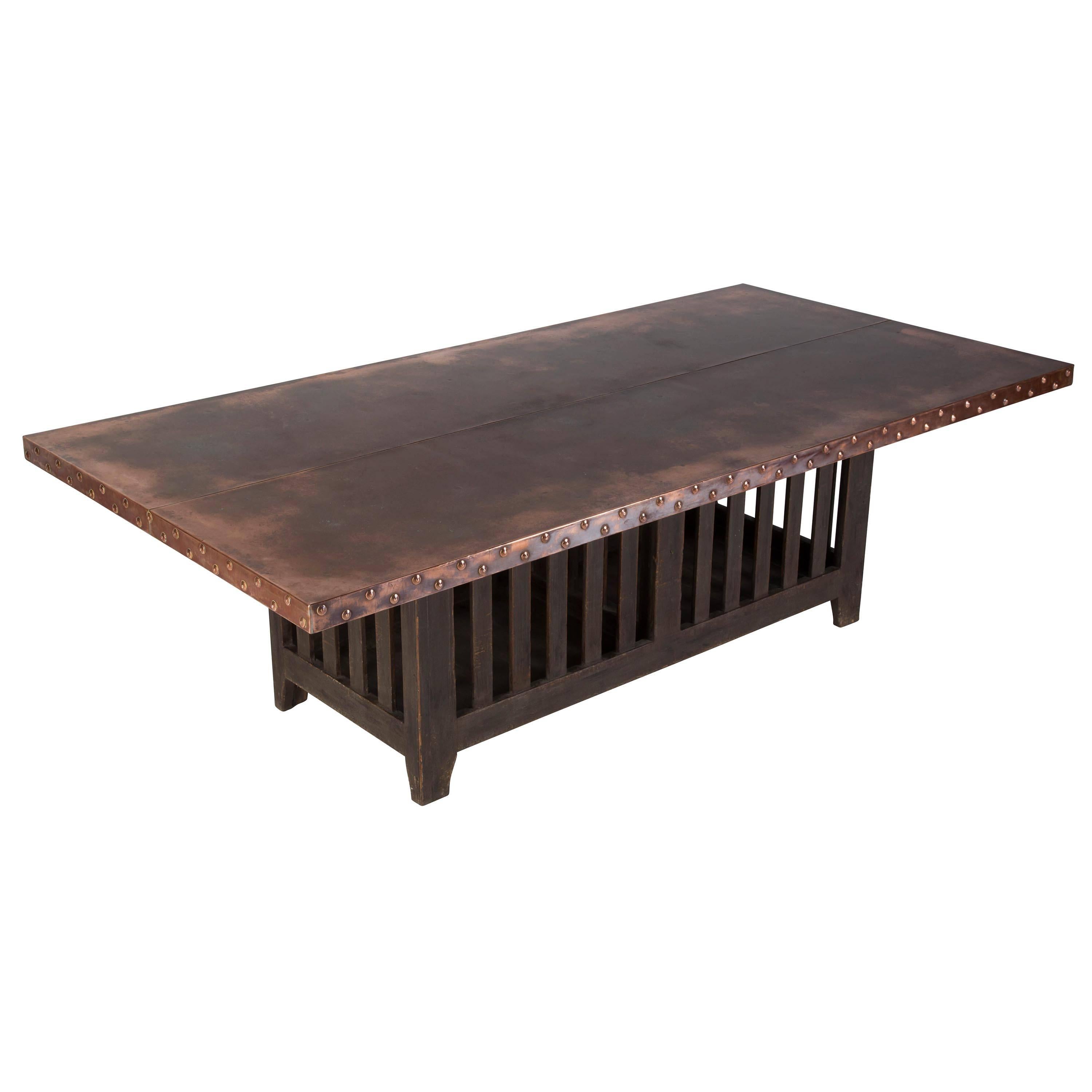 Large dining or shop table. The slatted base is from the arts and crafts design period and has a later handmade copper top. The base is lit by low energy lighting.