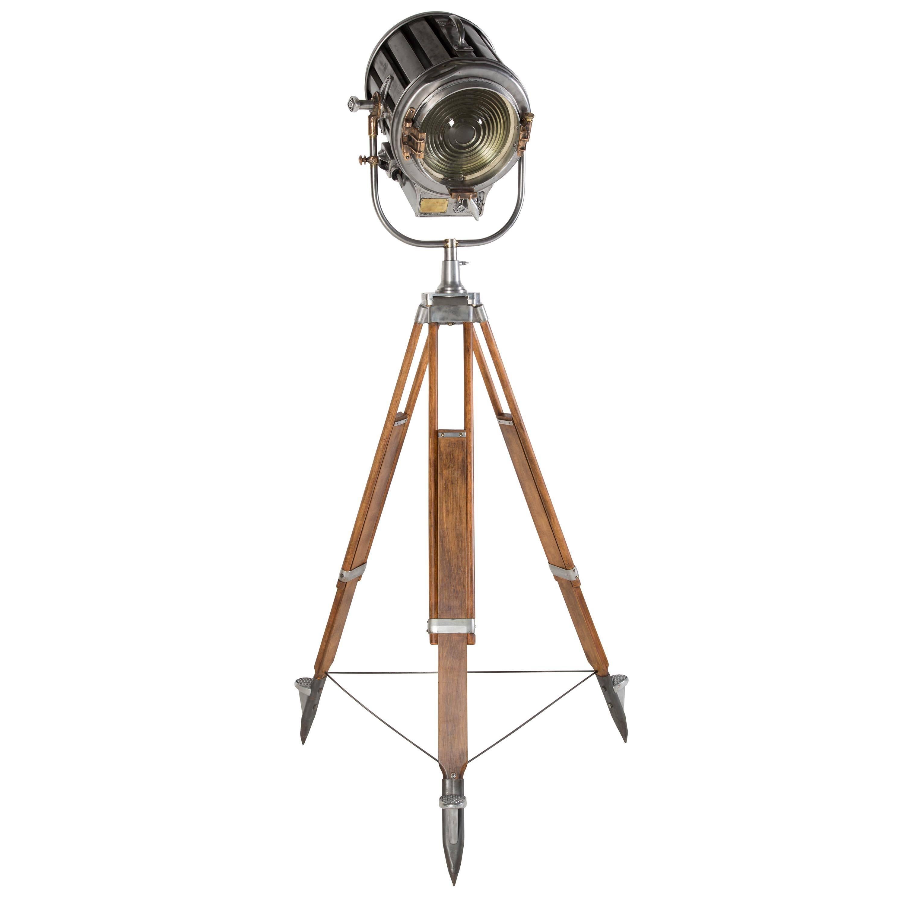 A large antique theatre light on stand by Mole Richardson, circa 1930. All restored to a very high standard, having been completely rewired and PAT tested. The lamp still retains its original flood to spot adjustment. It was purchased with a group