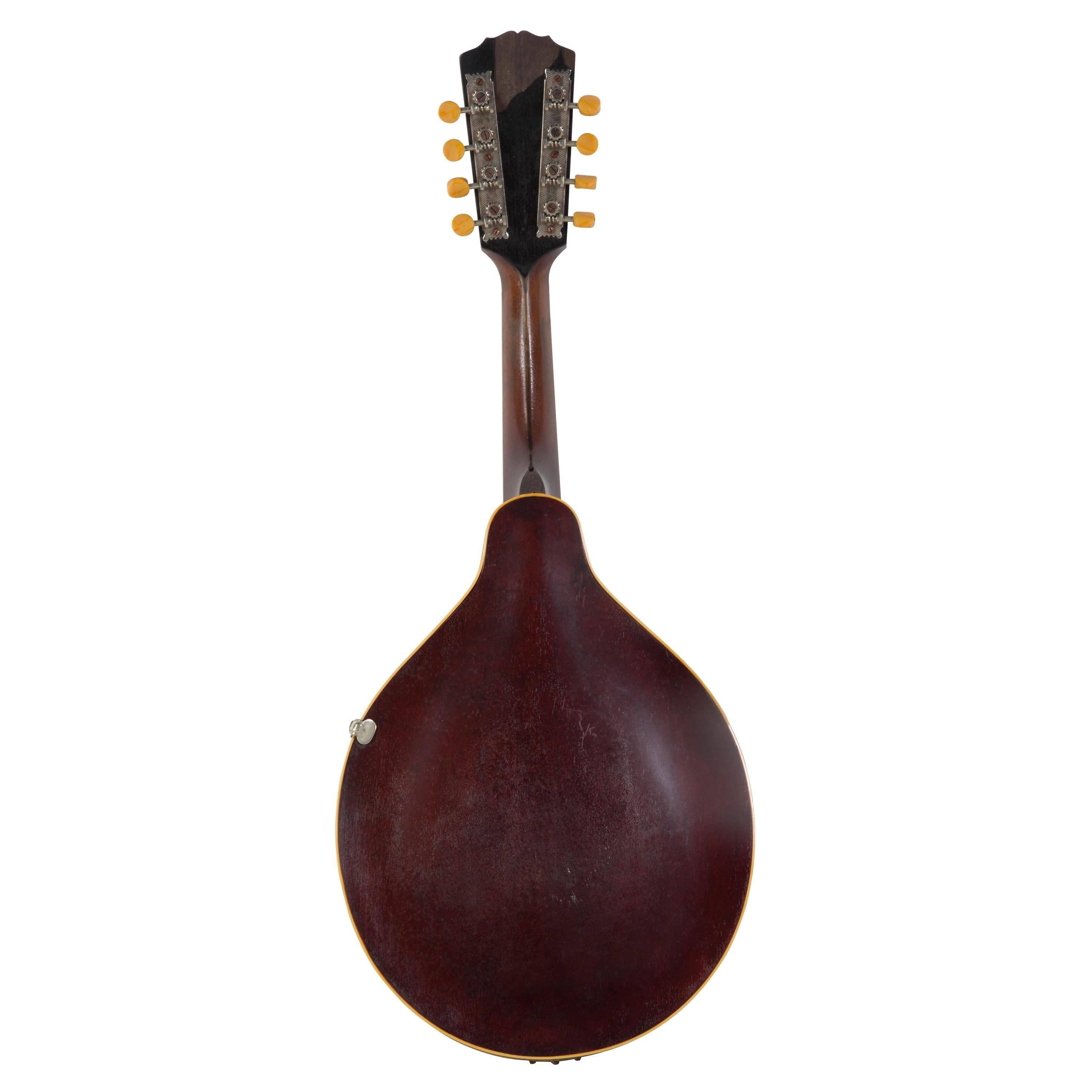 A 'The Gibson' A4 Mandolin, America 1919. The A4 was the top of the line of the Gibson A series Mandolins. These mandolins are renowned for their tone.
This example is in untouched original condition. There is a sliver of veneer lacking on the head