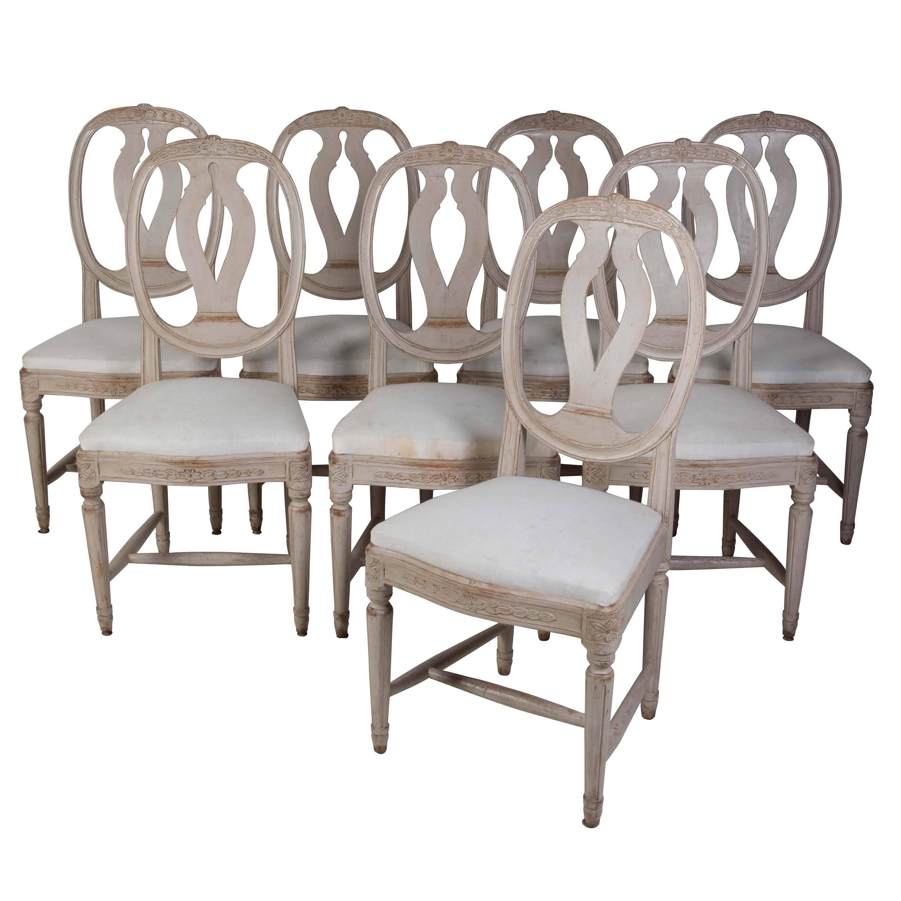 A set of eight painted Gustavian dining chairs – Swedish, circa 1860. Seat height 49 cm. Seat depth 40 cm.
