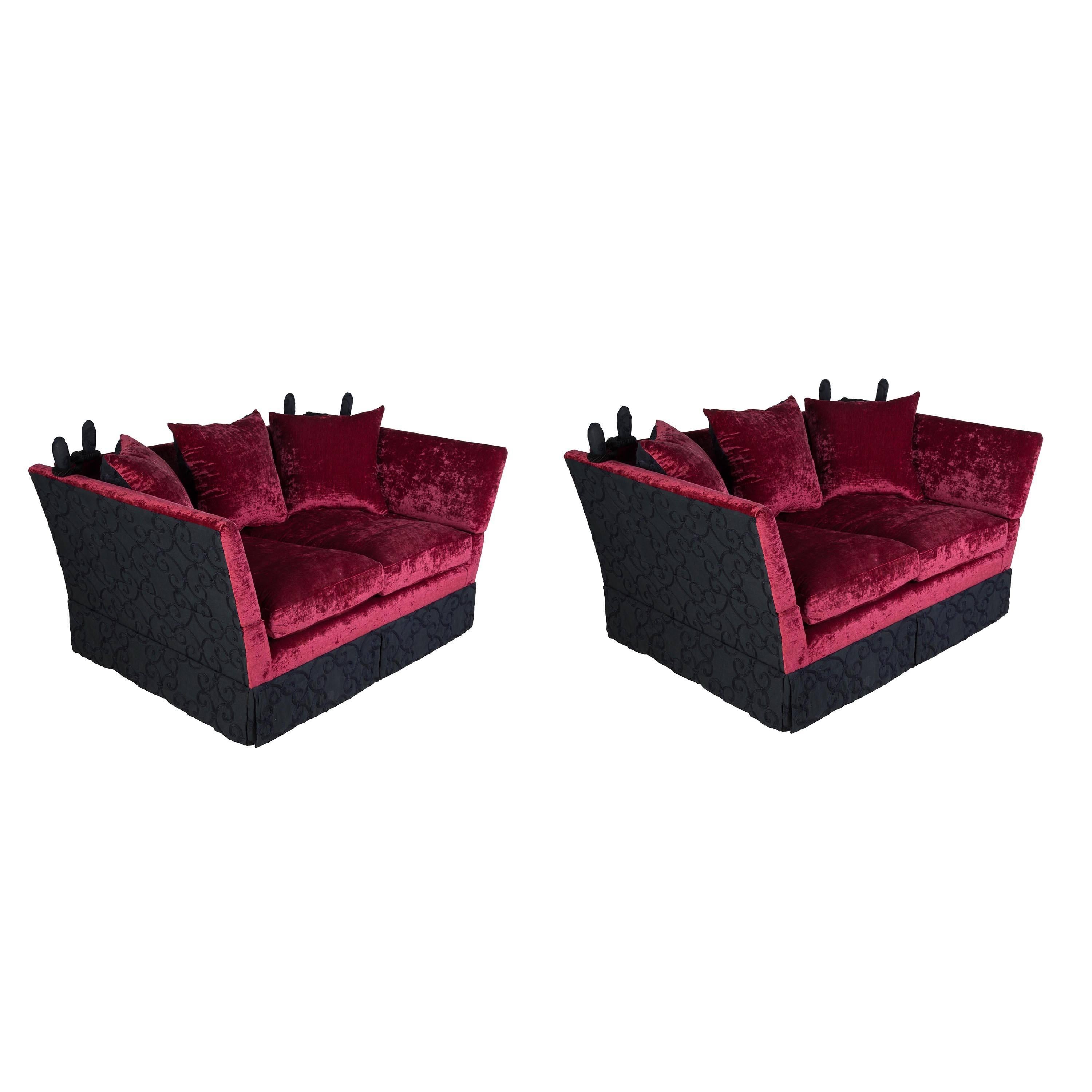 A pair of 1960s Knole sofas luxuriously recovered in velvet and embroidered linen.