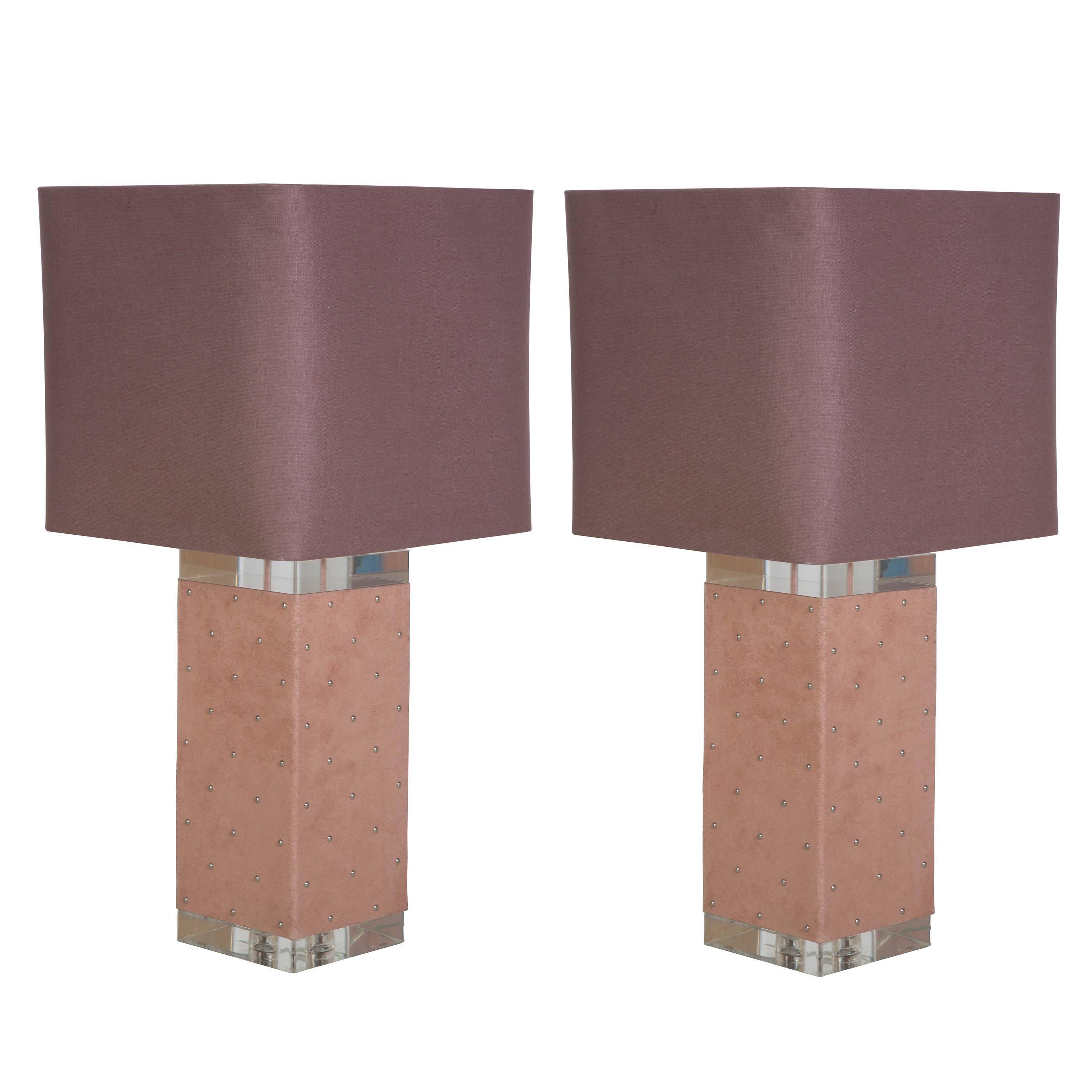 A pair of large 1970s square, suede wrapped, Lucite table lamps with studded detail.