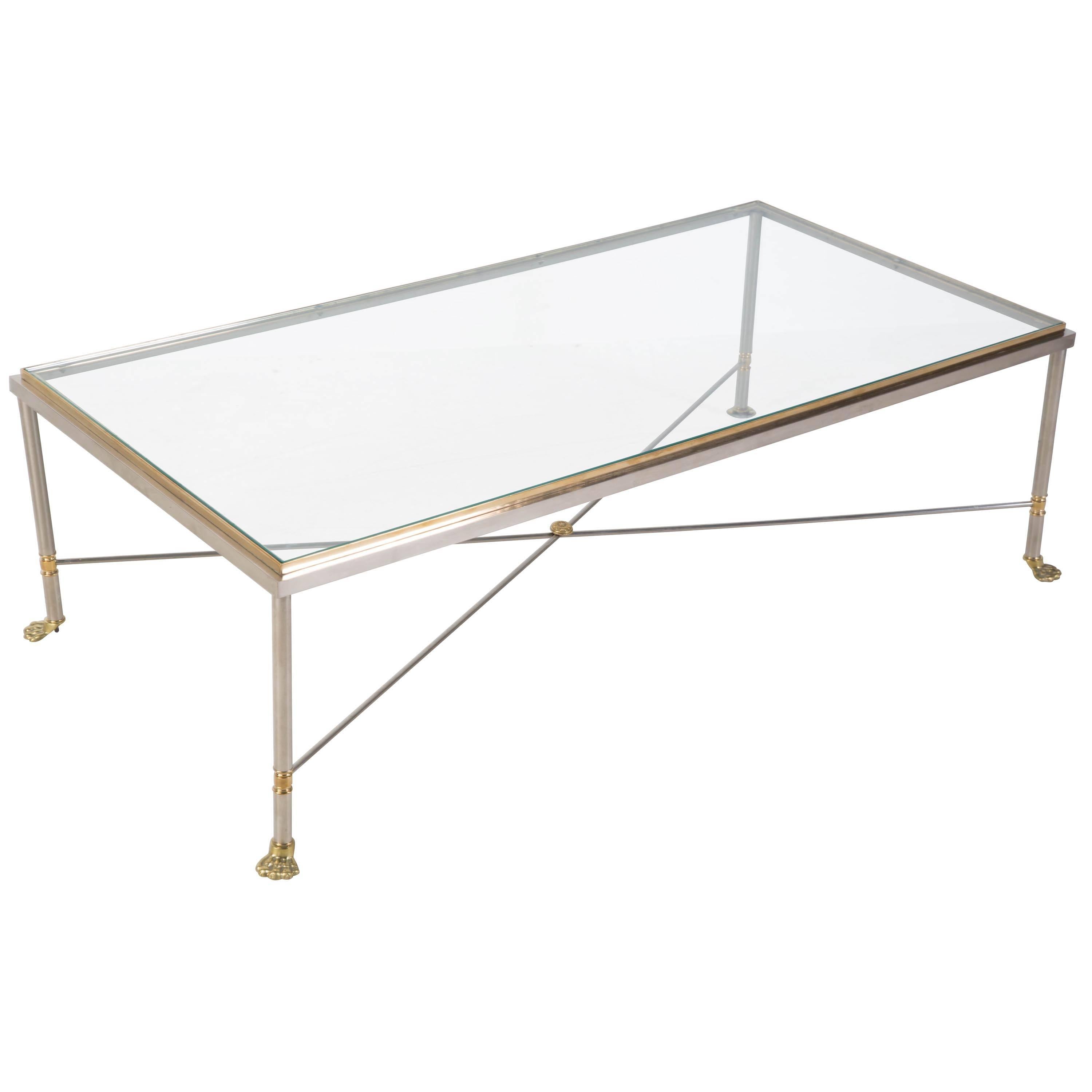 Brushed steel and brass coffee table in the style of Maison Jansen with paw feet