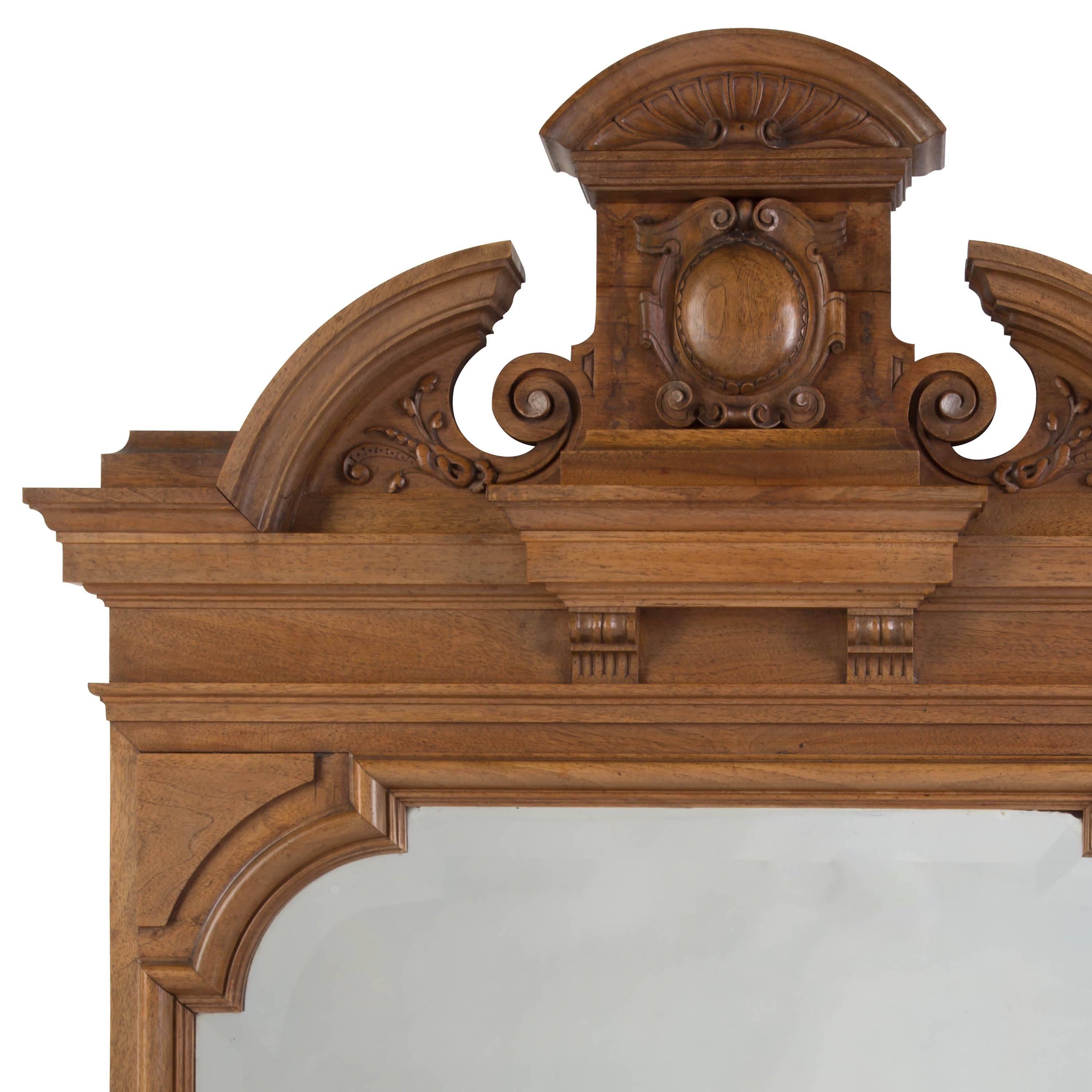 A pair of 19th century irish neoclassical carved walnut mirrors.