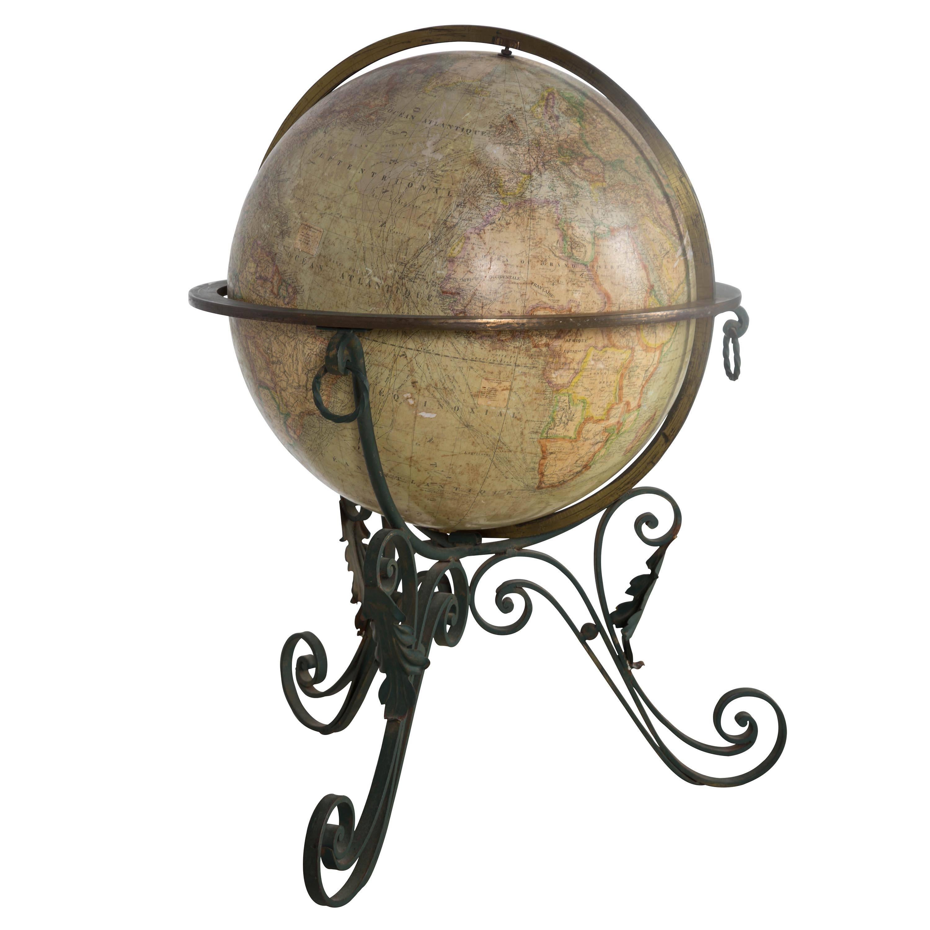 A 19th century terrestrial globe on decorative wrought iron base.