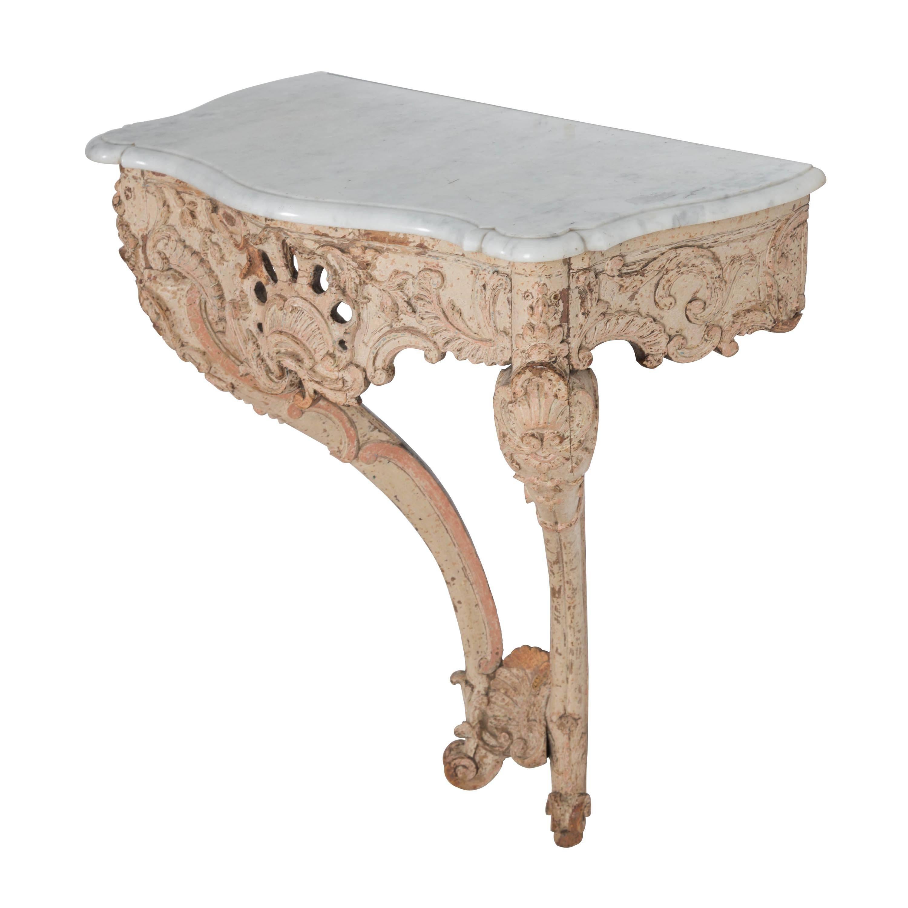 Decorated console table with marble top.