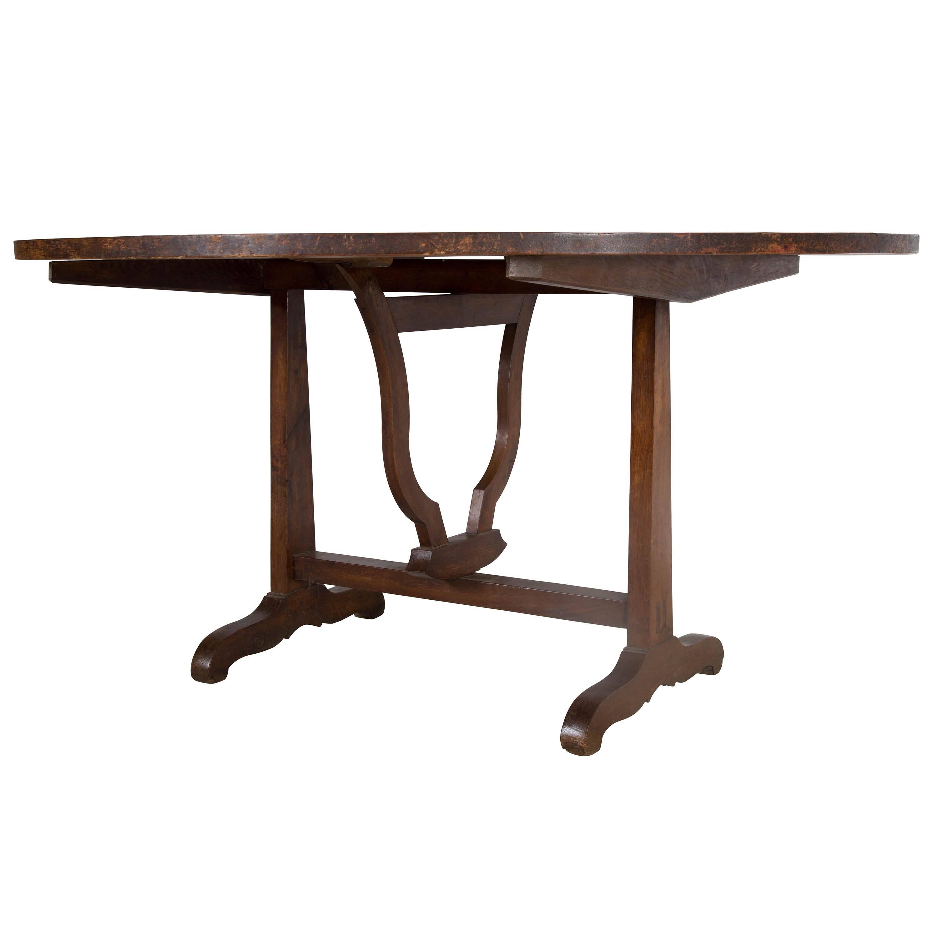 Large 19th century oak and pine vendange table. The top cross-banded with walnut and covered in oil cloth.