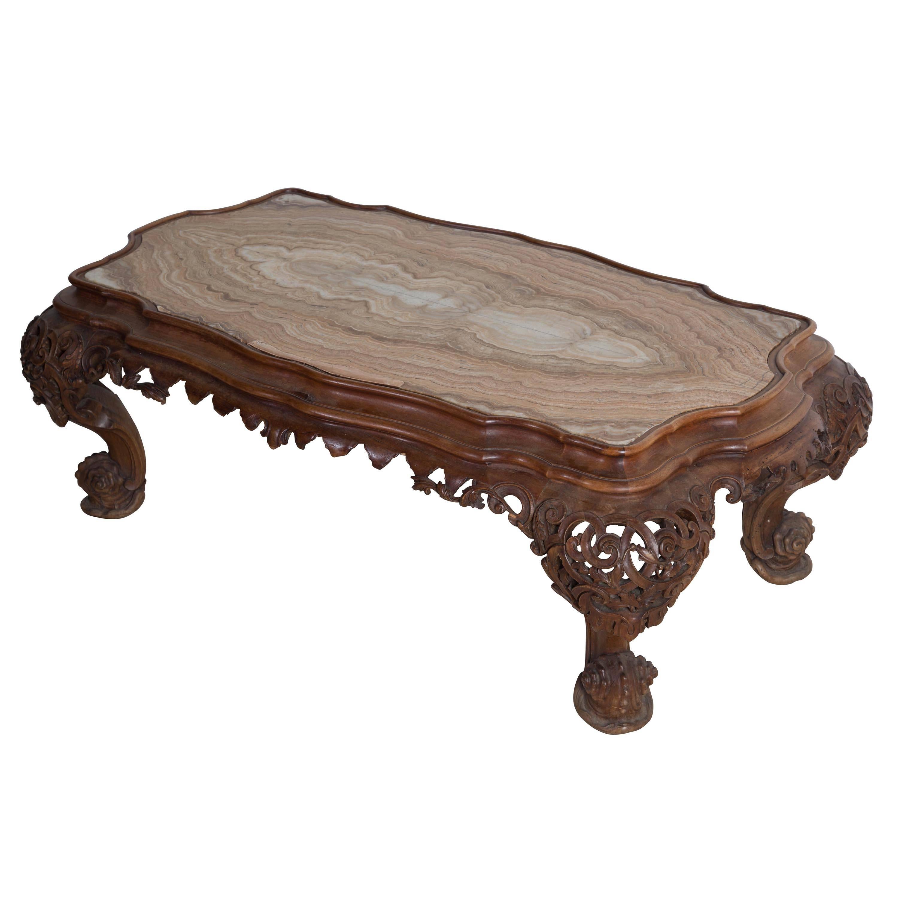 Venetian grotto coffee table with onyx top.
