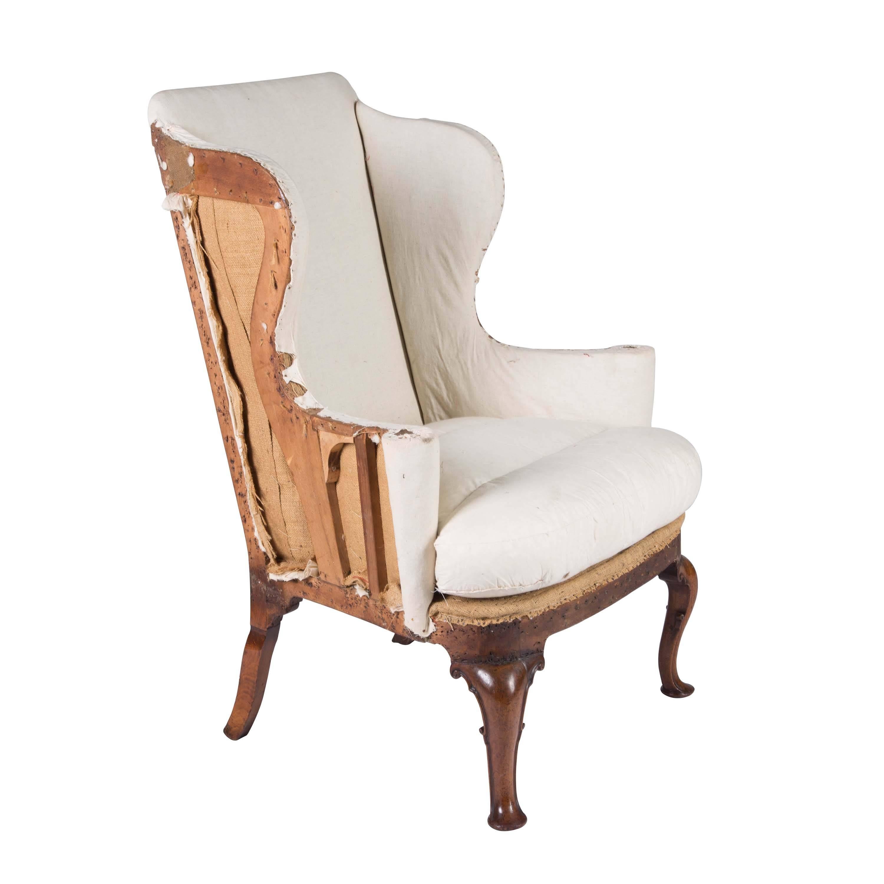 Queen Anne period walnut wingback chair, circa 1710.