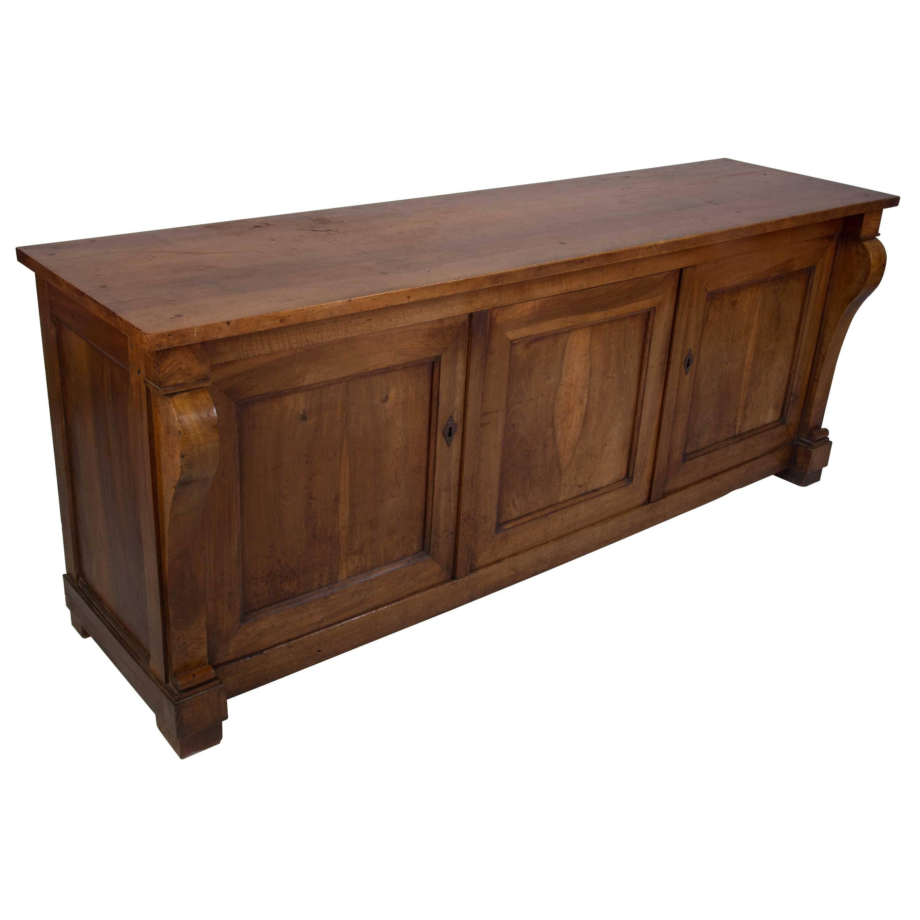 An early 19th century French walnut enfilade of wonderful shape and style, circa 1810.
