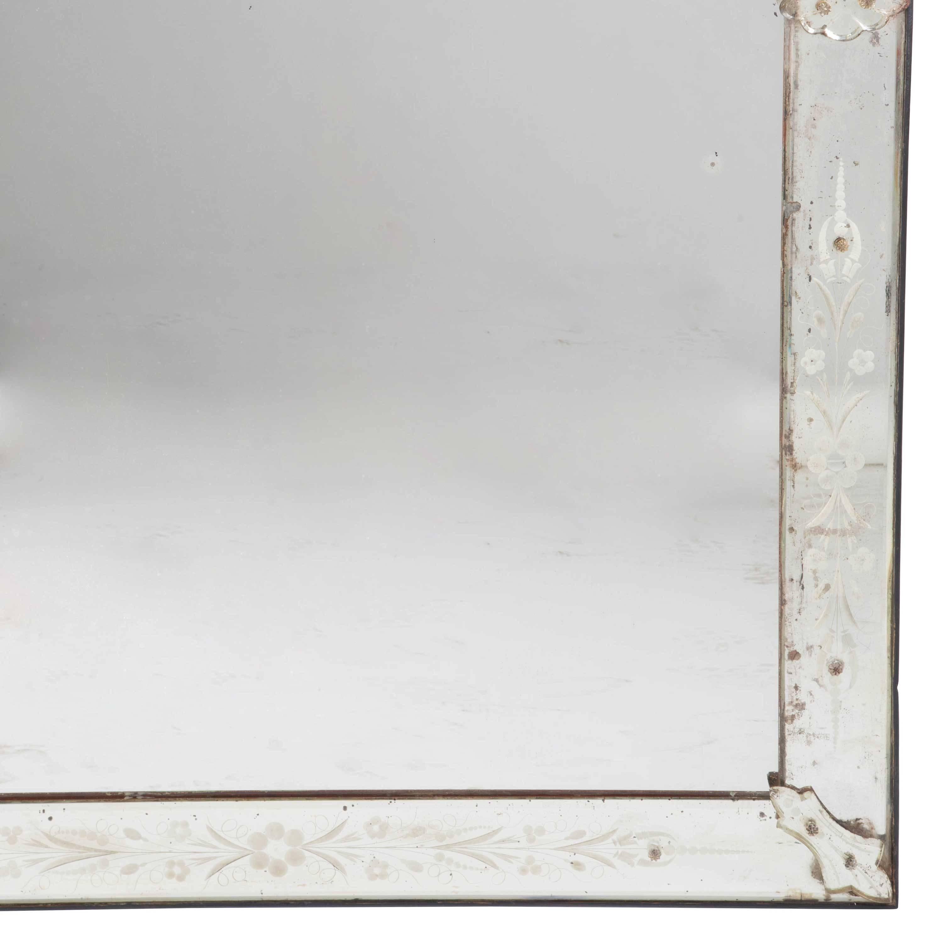 Large late 19th century Venetian mirror with good foxy mirror plate.