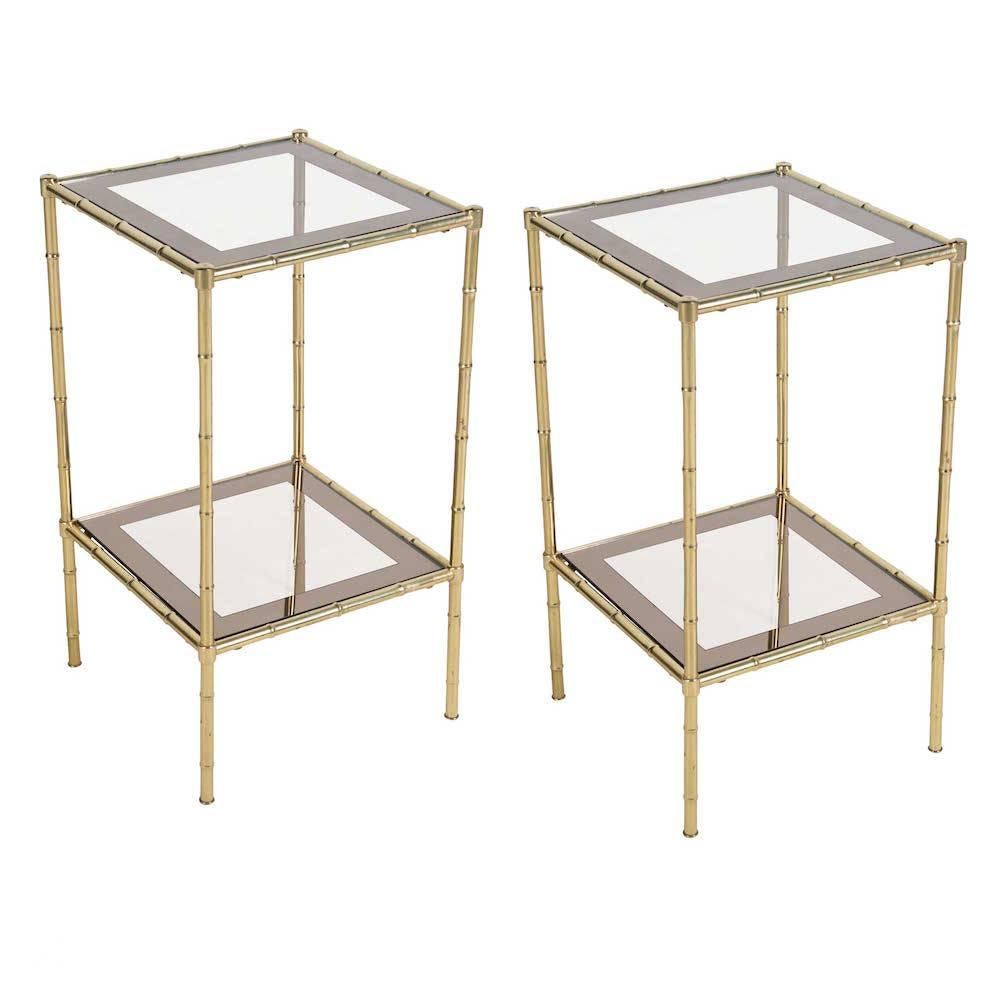 Pair of 1970s Jacques Adnet style faux-bamboo side tables in brass and smoked glass.