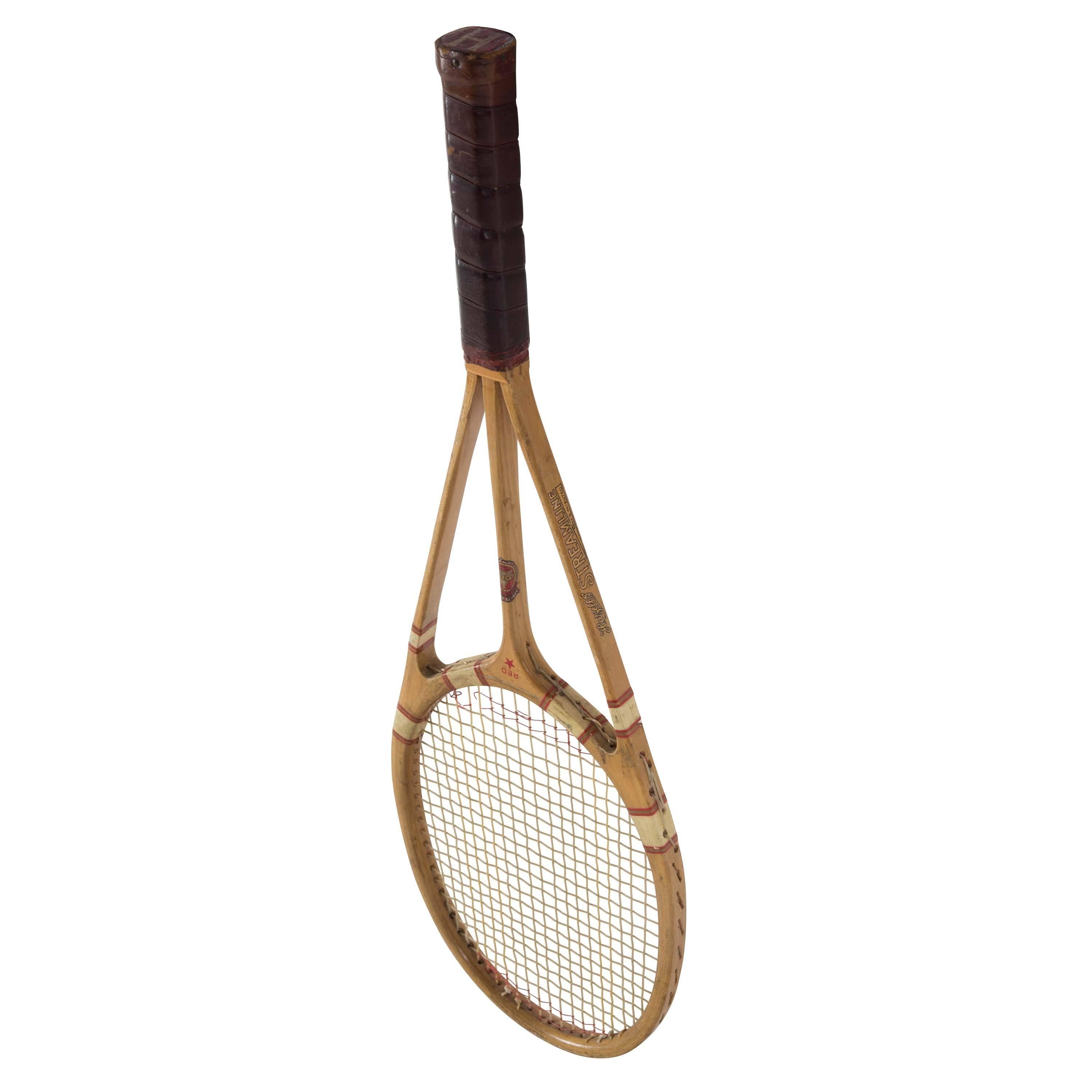 This iconic racket is in exceptional condition. Still with the original banding and decals. Showing just a few signs of use such as scuffing to the head. 2/3 new strings. The racket was in production for about three years. Designed in the mid-1930s