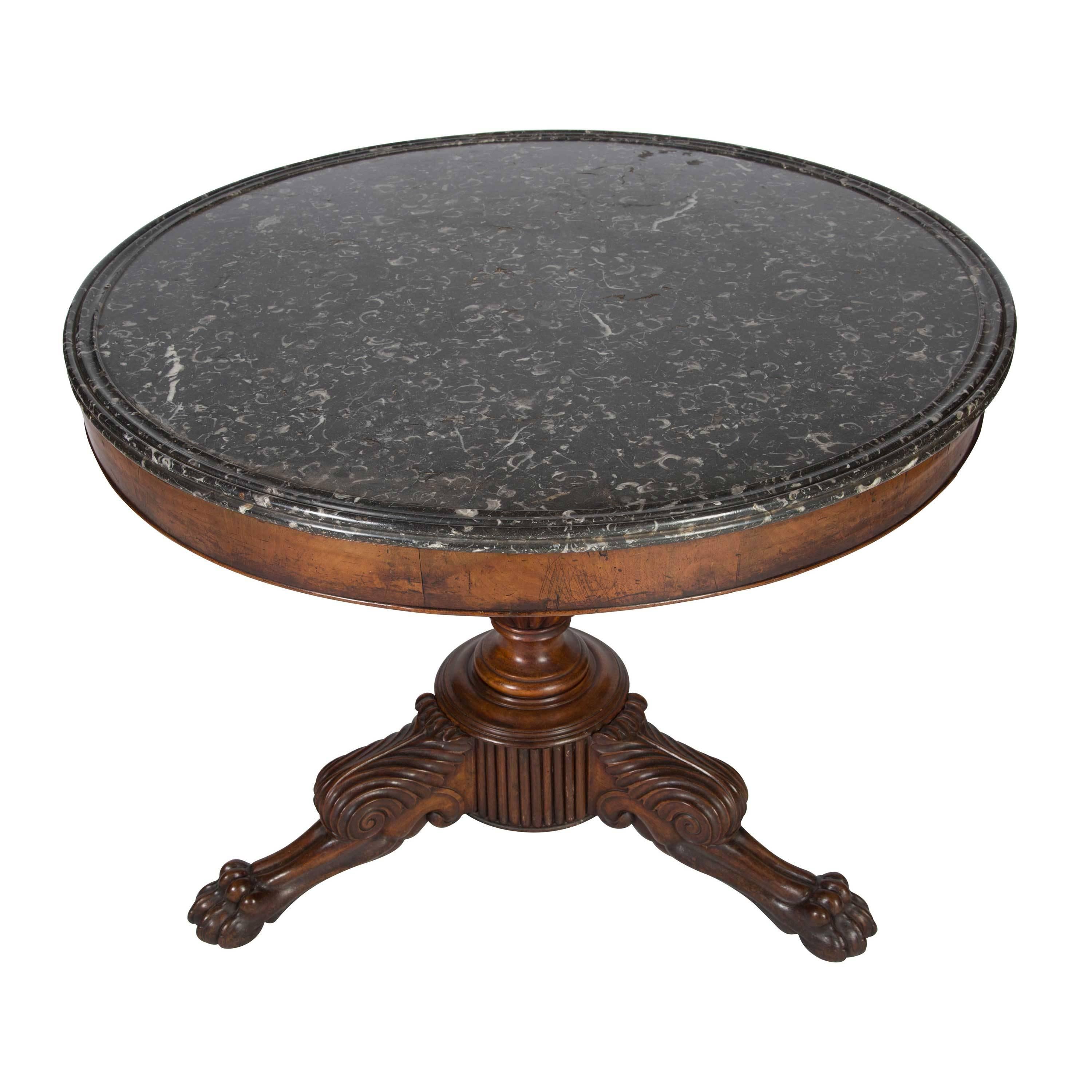 Louis Phillipe walnut gueridon center table with a superb grey fossil marble-top, circa 1840.
  