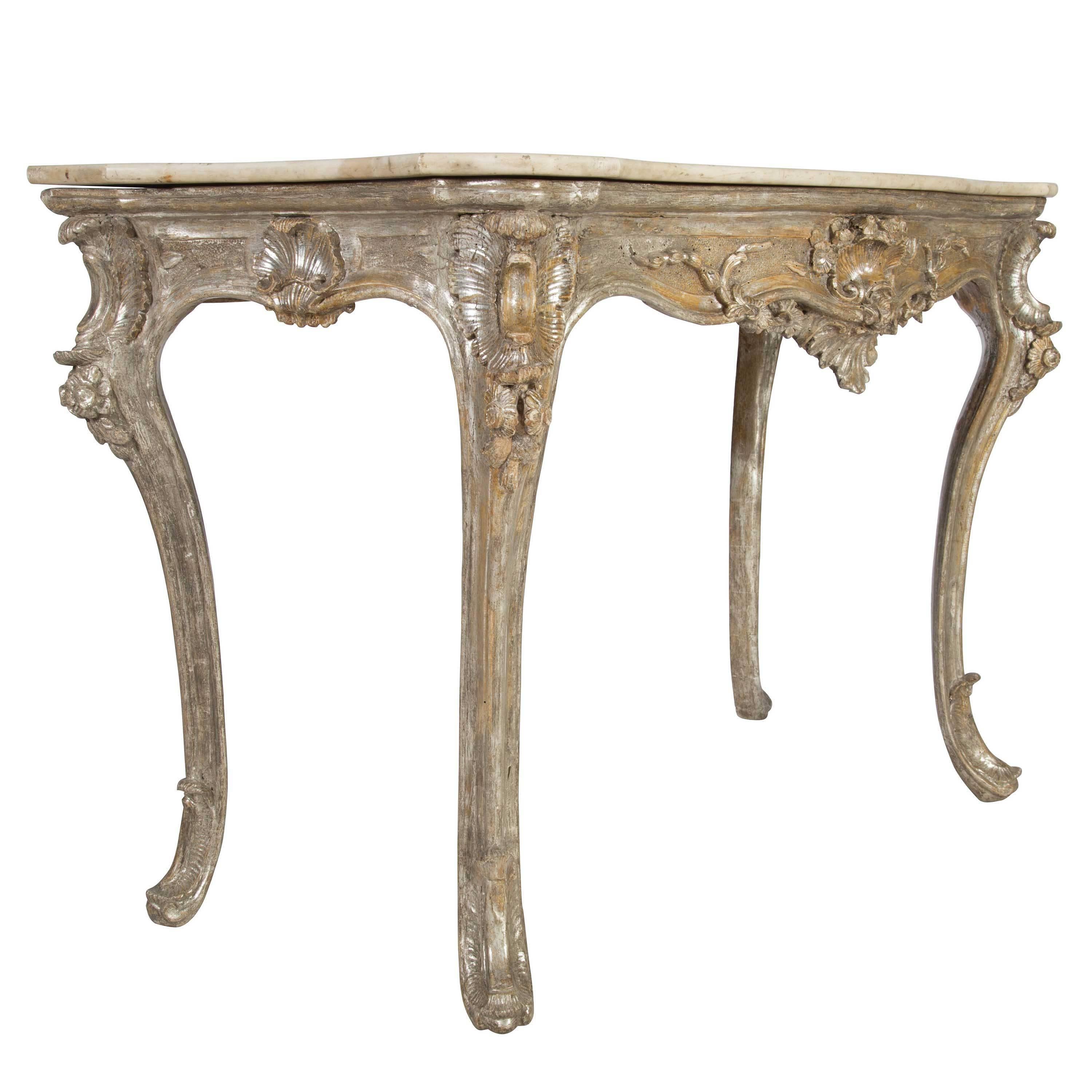 An 18th century Italian Rococo period console table in refreshed original silver gilt and with original marble top.