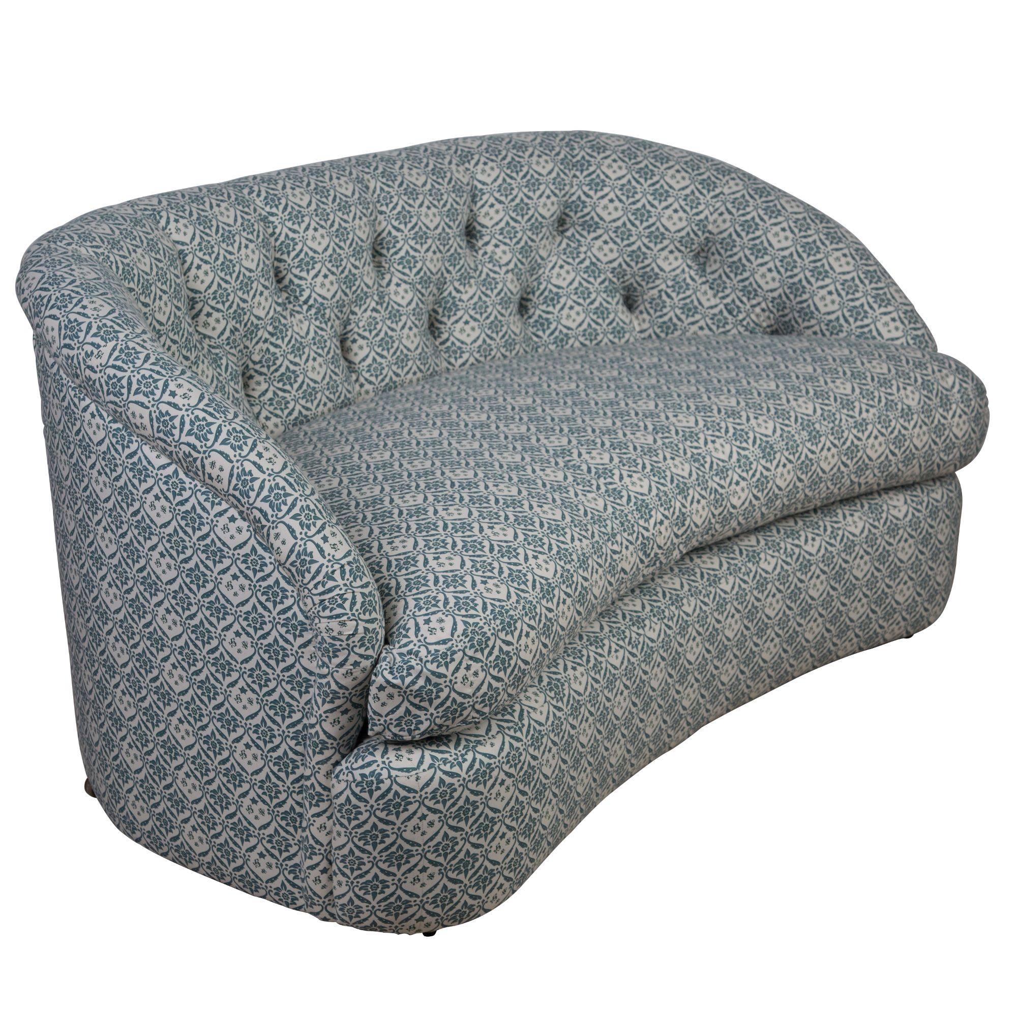 A 1930s Howard and Sons loveseat, fully reupholstered and recovered in a copy of the original Howard & Sons ticking. Measure: Seat height 45cm. Seat depth 60cm.
