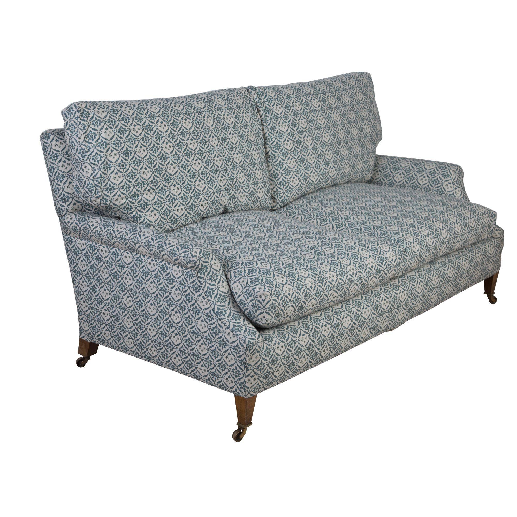 A 1940s two-seat sofa made by Lenygon and Morant for Howard and Sons. Re-upholstered in a copy of the Classic H&S ticking.
