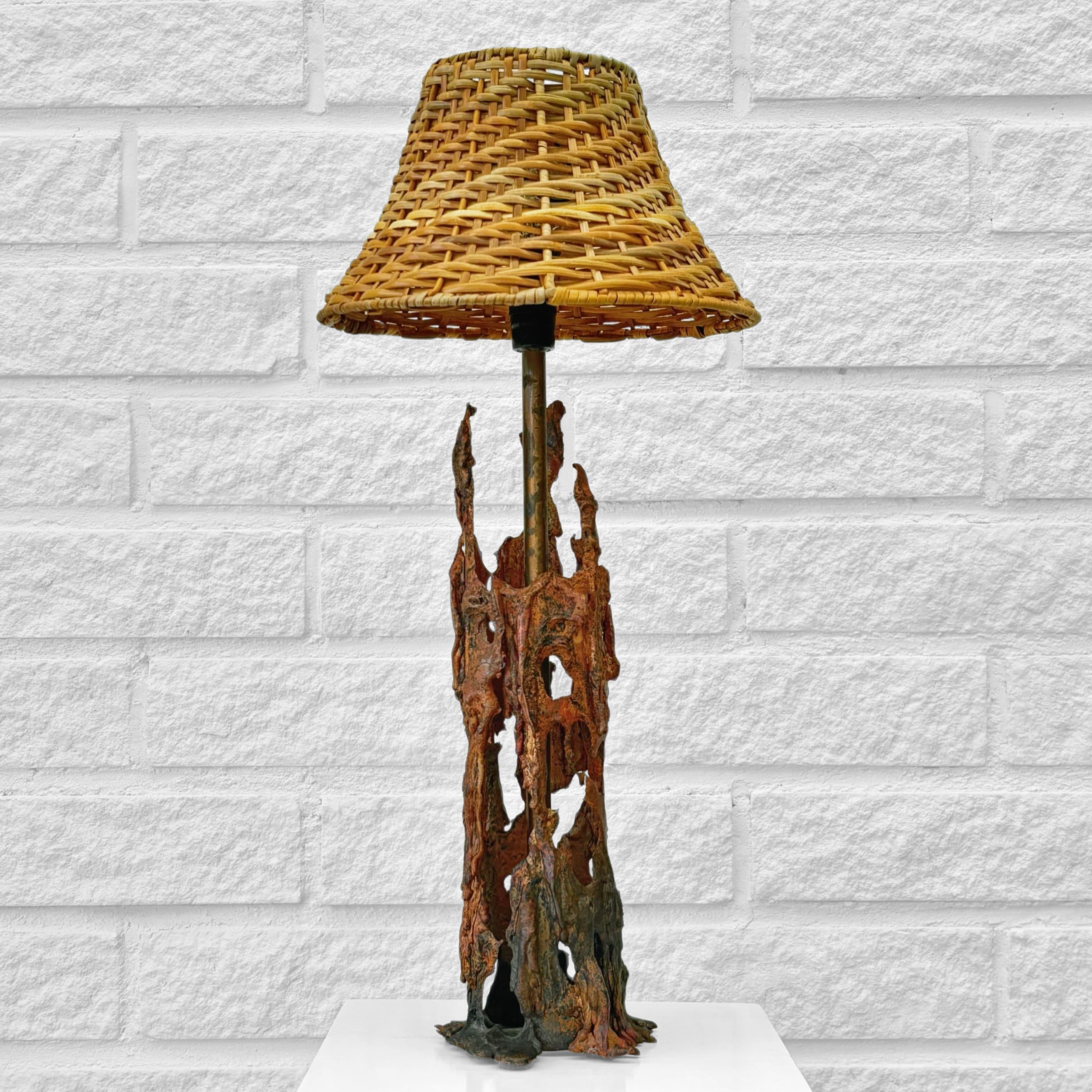 A sculptural, handcrafted Scandinavian brutalist table lamp, constructed from partially melted copper. The lamp holder is mounted on a copper pipe marked Svenska Metallverken, a company founded in the late 19th century that supplied metal products