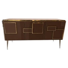 Italian sideboard with three chocolate-colored glass doors and brass accents