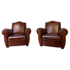 A Stunning Pair of French Leather Club Chairs Chapeaux de Gendarme, Circa 1950's
