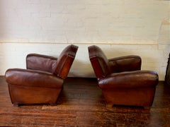 A Stunning Pair of French Leather Club Chairs Chapeaux de Gendarme, Circa 1950's