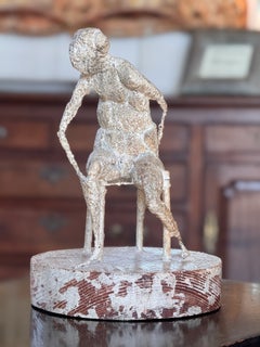 Abstract Sculpture of a Seated Figure