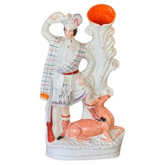 Staffordshire Figure of a Hunter with Deer
