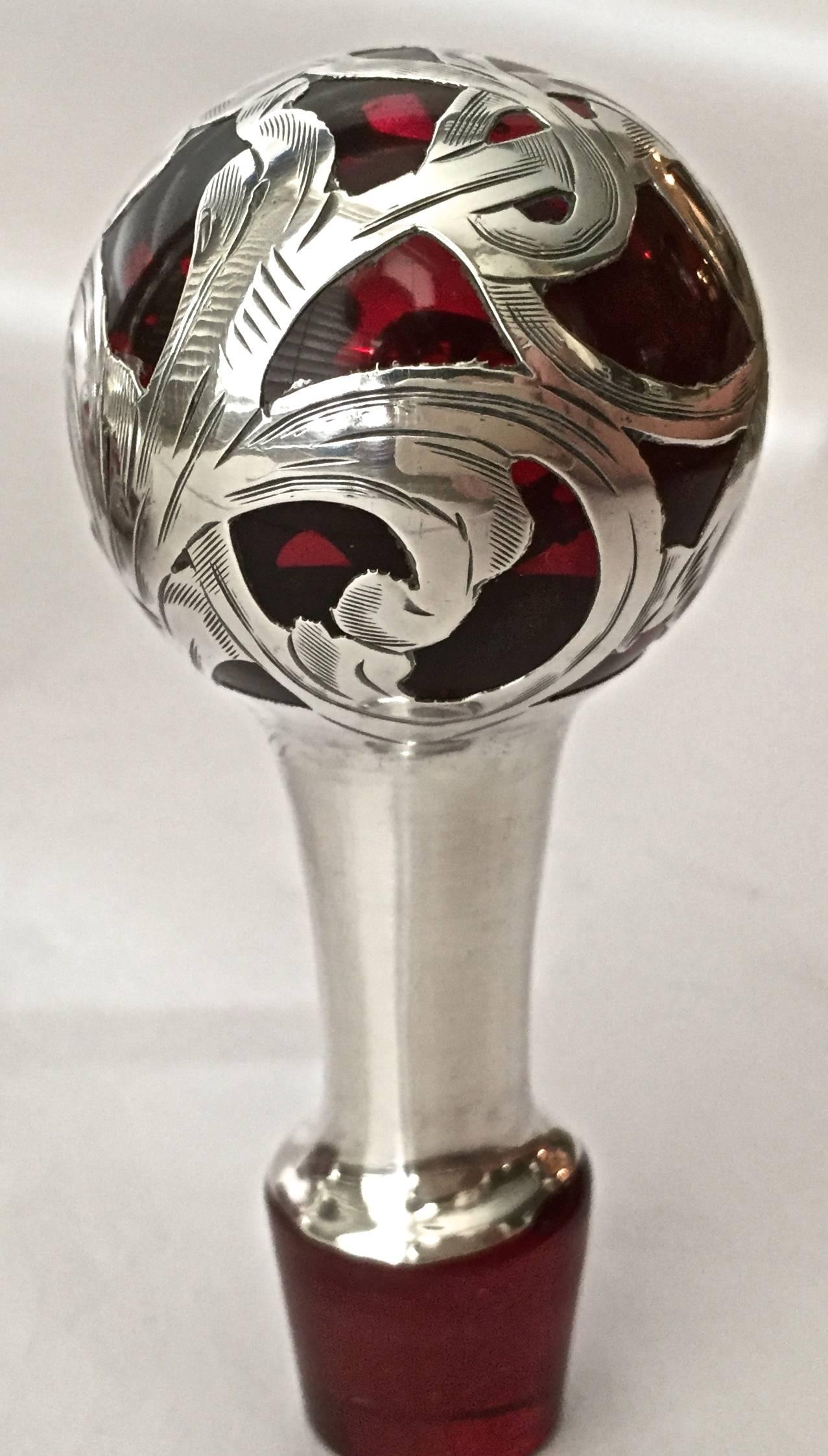 This is the one, as fine a silver overlay decanter as we have ever had, large, the best color that ever was, beautifully chase, and in a vintage Art Nouveau pattern. That will look great in any decor or be a leader in the most sophisticated