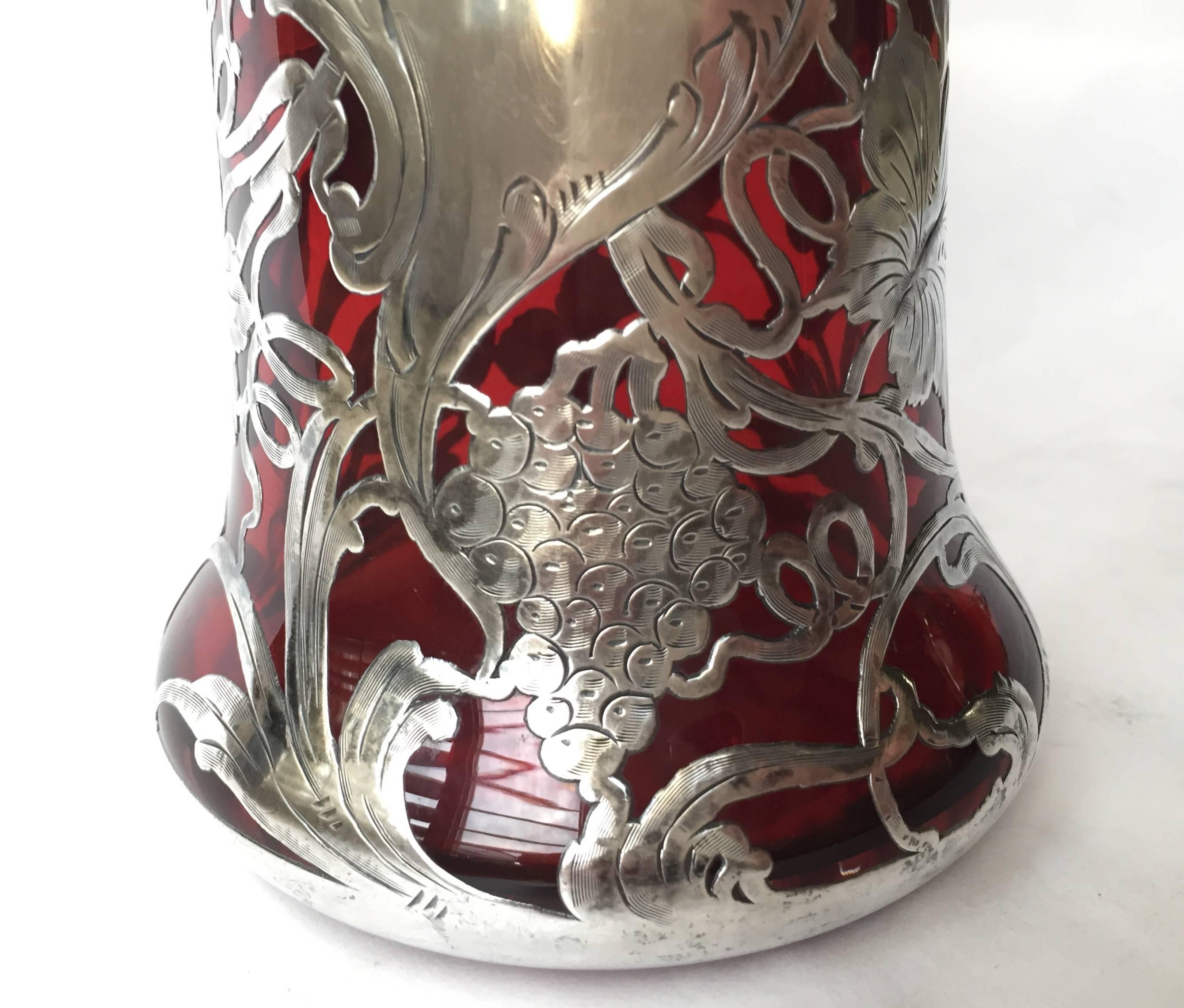 A lovely sterling silver overlay vase, American, circa 1900 the silver in a vintage pattern beautifully chased. The red color is highly sought after it looks so great 
against the silver. In exceptional condition and can double as a vase.
 