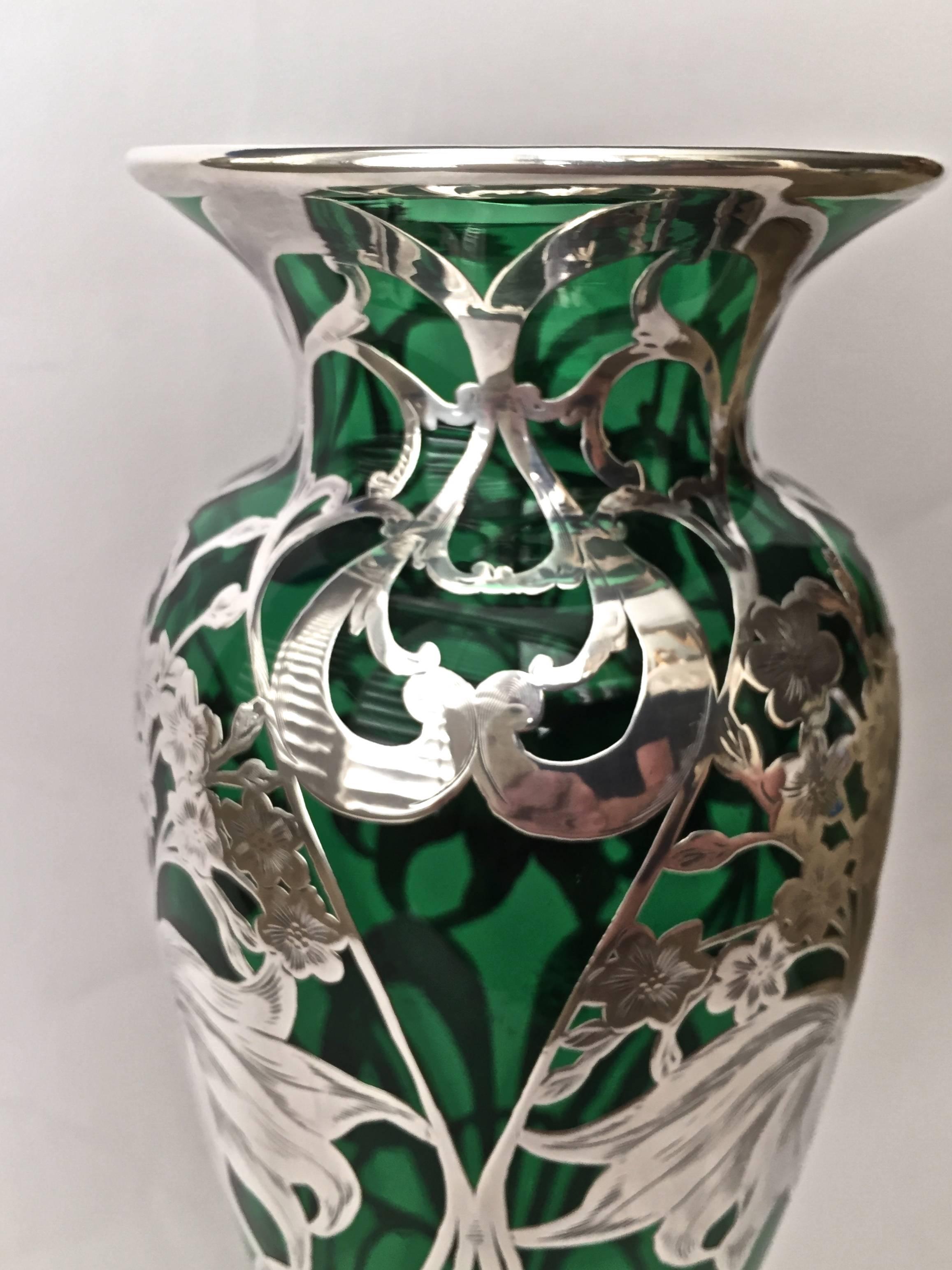 Amazing is this large Art Nouveau sterling silver overlay vase, with a beautifully
floral pattern, the silver work as good as it gets all chased over with highlights
and details, a large size and a graceful shape.