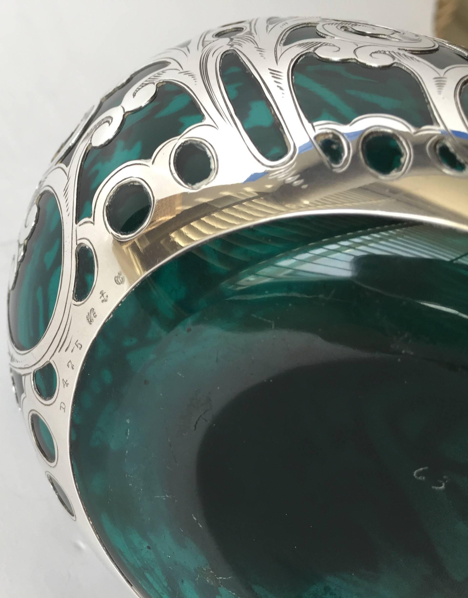 Art Nouveau green blue glass silver overlay decanter 19th century, with an applied silver handle and stopper. Beautiful silver work on this example, the design strong and the silver chased over, with no monogram present. In very nice condition for
