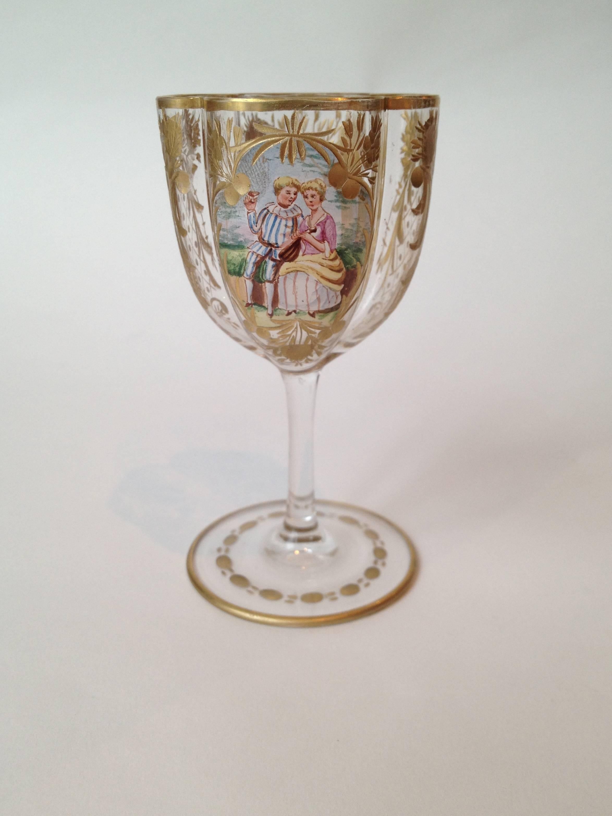 The most complete set we have ever seen so many shapes and sizes, for 12
with eight pieces per place setting. The scenes hand-painted enamel expertly
done, the etching and gilding fantastic with flowers and diapering, the glass blown out in a