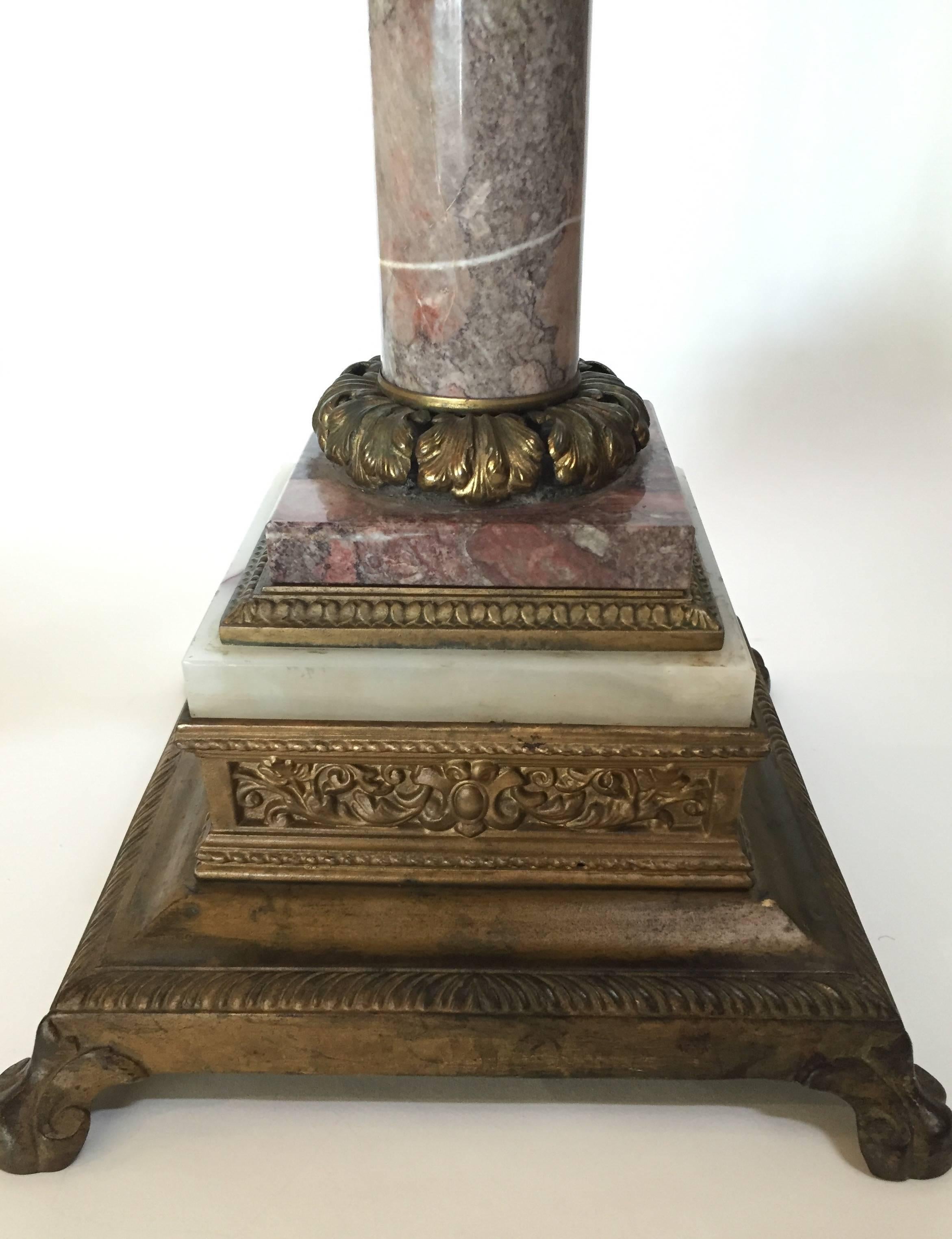 A lovely Renaissance style table or stand 19th century Italy, the very highly cast figures on the bronze section are fine and the use of several marble specimens rare, with gilt bronze mounts. This is a rare and unusual piece that you will find is