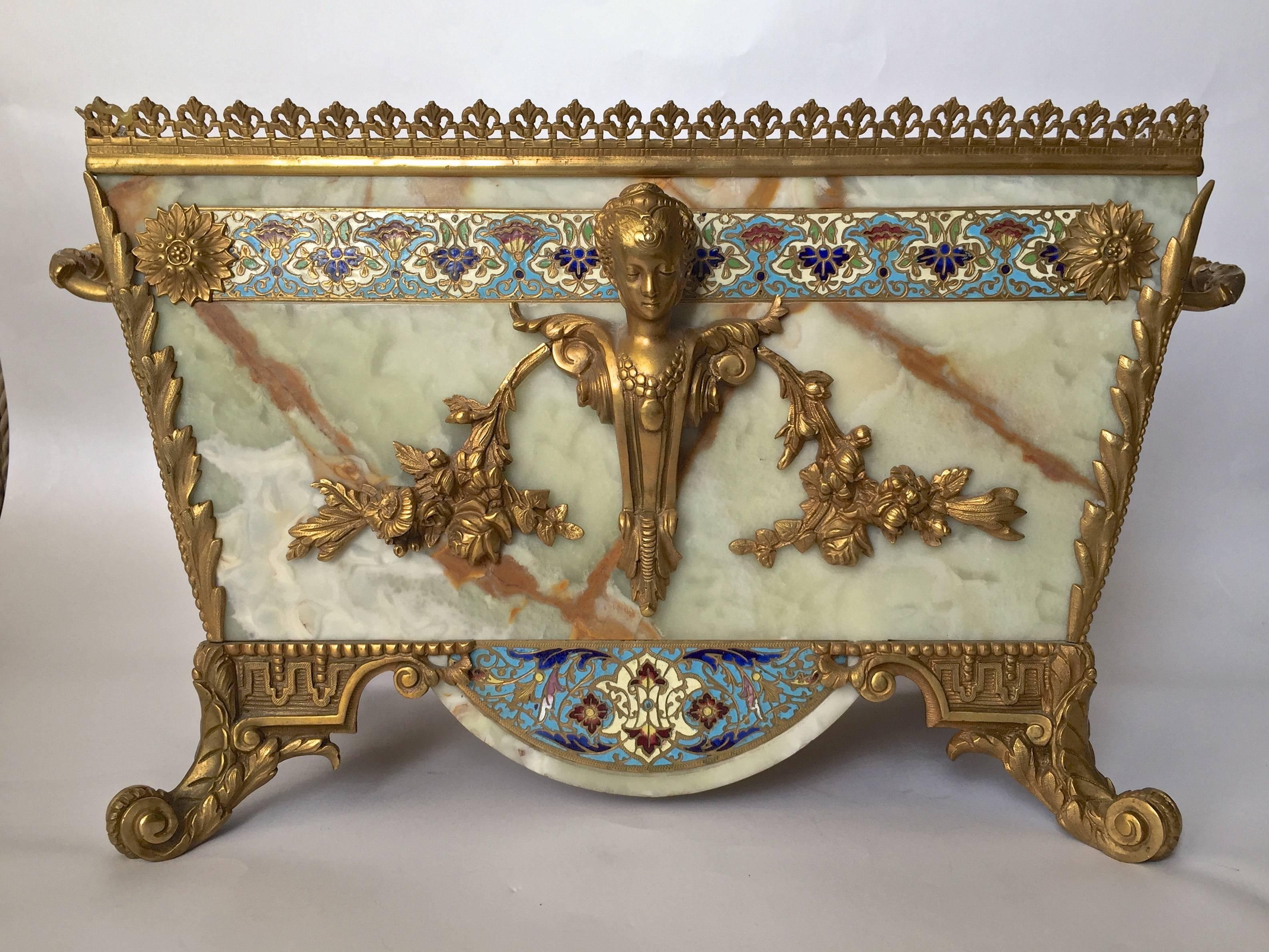 An exceptional Jardiniere on stand of champleve enamels with onyx, marble and gilt bronze in the Louis 16th style, fantastic quality is found here wonderful decorative value as well. The Champleve is very fine and the casting and chasing of the