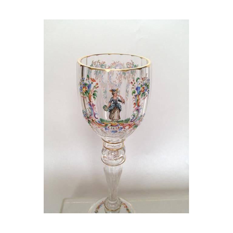 A fine set of eight Lobmeyr style wine glasses, beautifully hand-painted in polychrome enamels and with gilt highlights, in fantastic condition, each painted with a lady or gentleman dressed in 18th century attire.