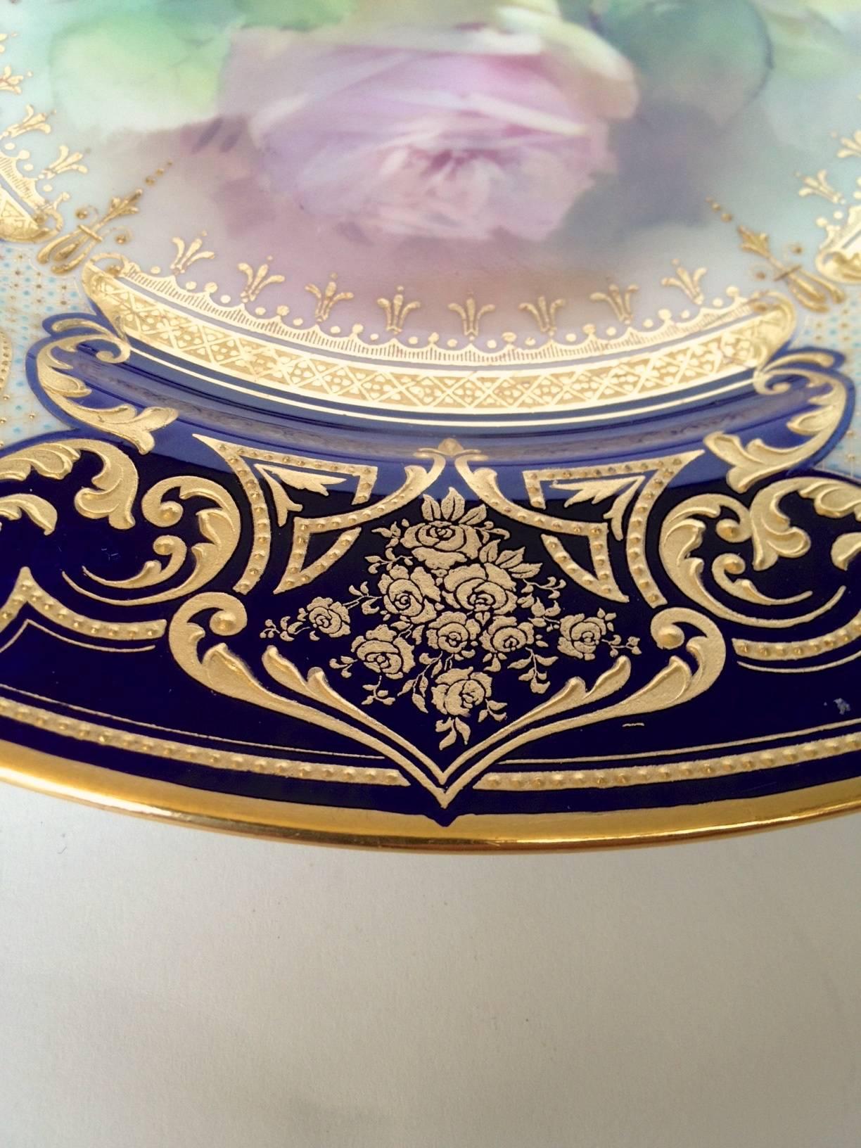 Gorgeous pair of English hand-painted and raised paste gilt cabinet plates expertly hand-painted by W. Slater for Royal Doulton you can almost smell the large roses yellow and pink so nice for decoration or a special dinner for two as the service