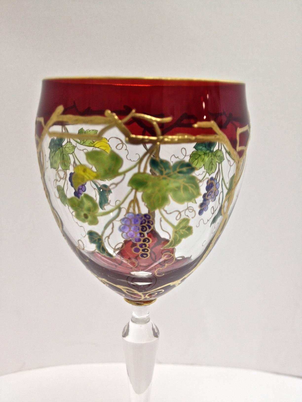 Art Nouveau enameled and gilt wine glasses so elegant the raised gilt highlight
The red glass and beautiful enameled grape vines. Perfect for Christmas and of course all year long as well. Picture these on the shelf in your bar.