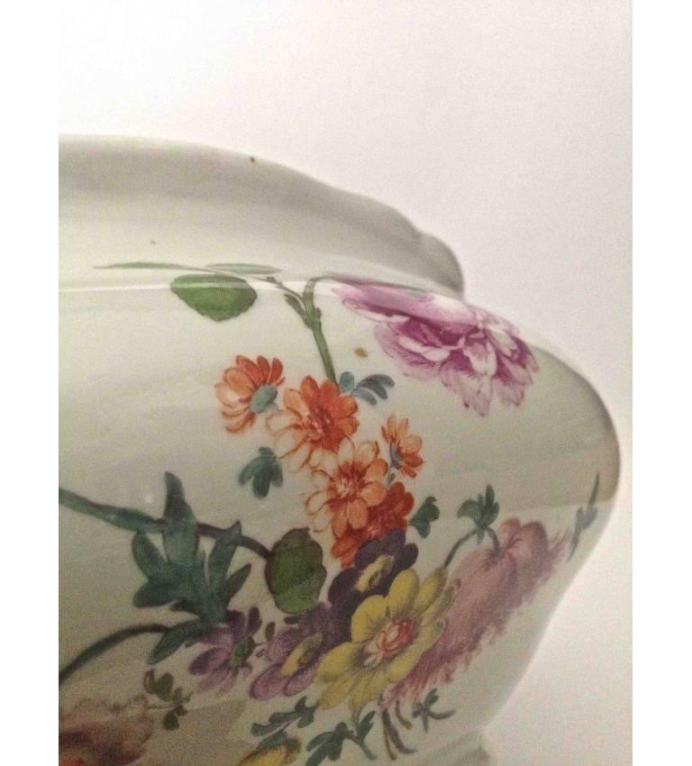 This lovely tureen beautifully hand-painted by an expert artisan, of large size and
in fantastic condition will be very useful and decorative as well. The coloration
of the polychrome enamels strong and life like, the term for the floral subject