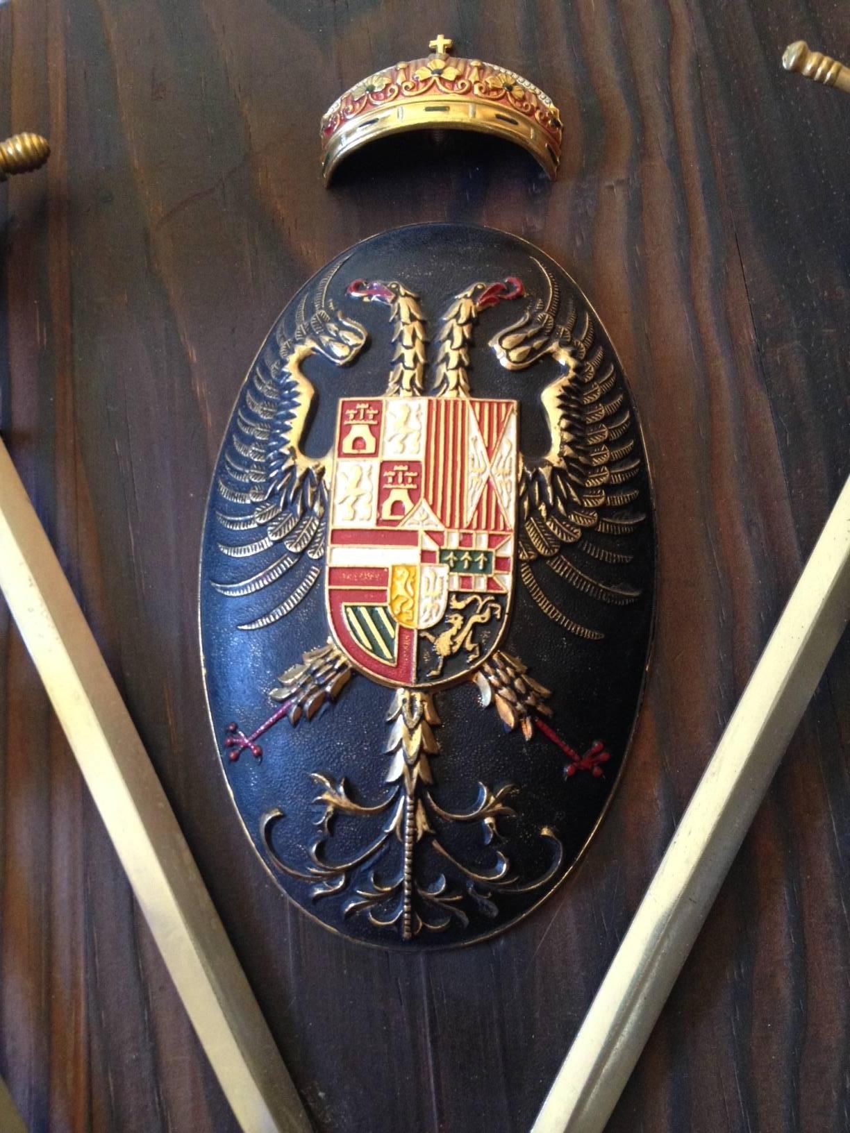 Beautiful Spanish sword set mounted on a carved wood plaque.