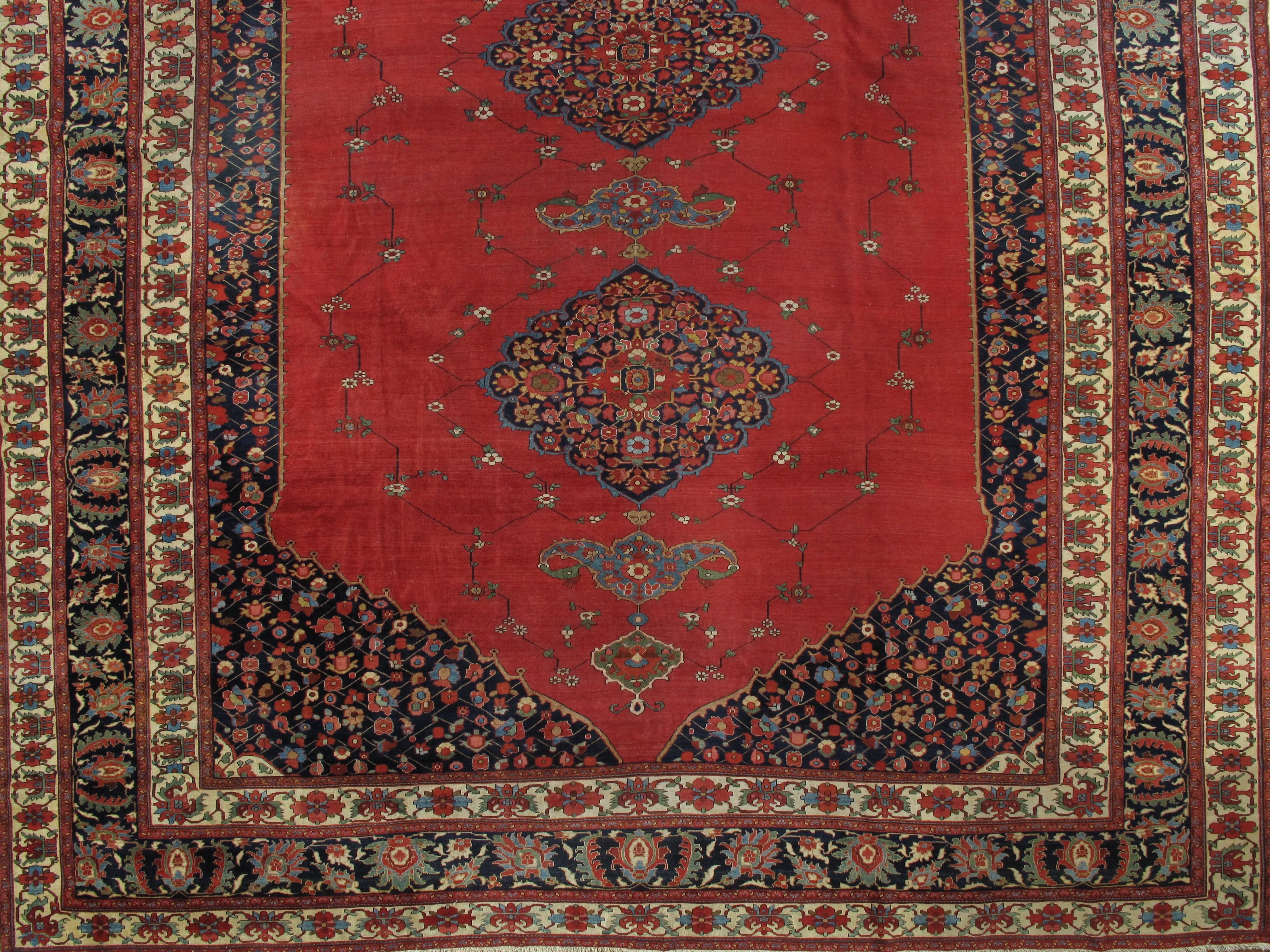 Finely woven Ferahan Sarouks were produced in the late 19th century until just before World War I. They've become extremely rare and are highly valued for their artistry and colors. This is a beautiful 19th century example. Size: 13'9