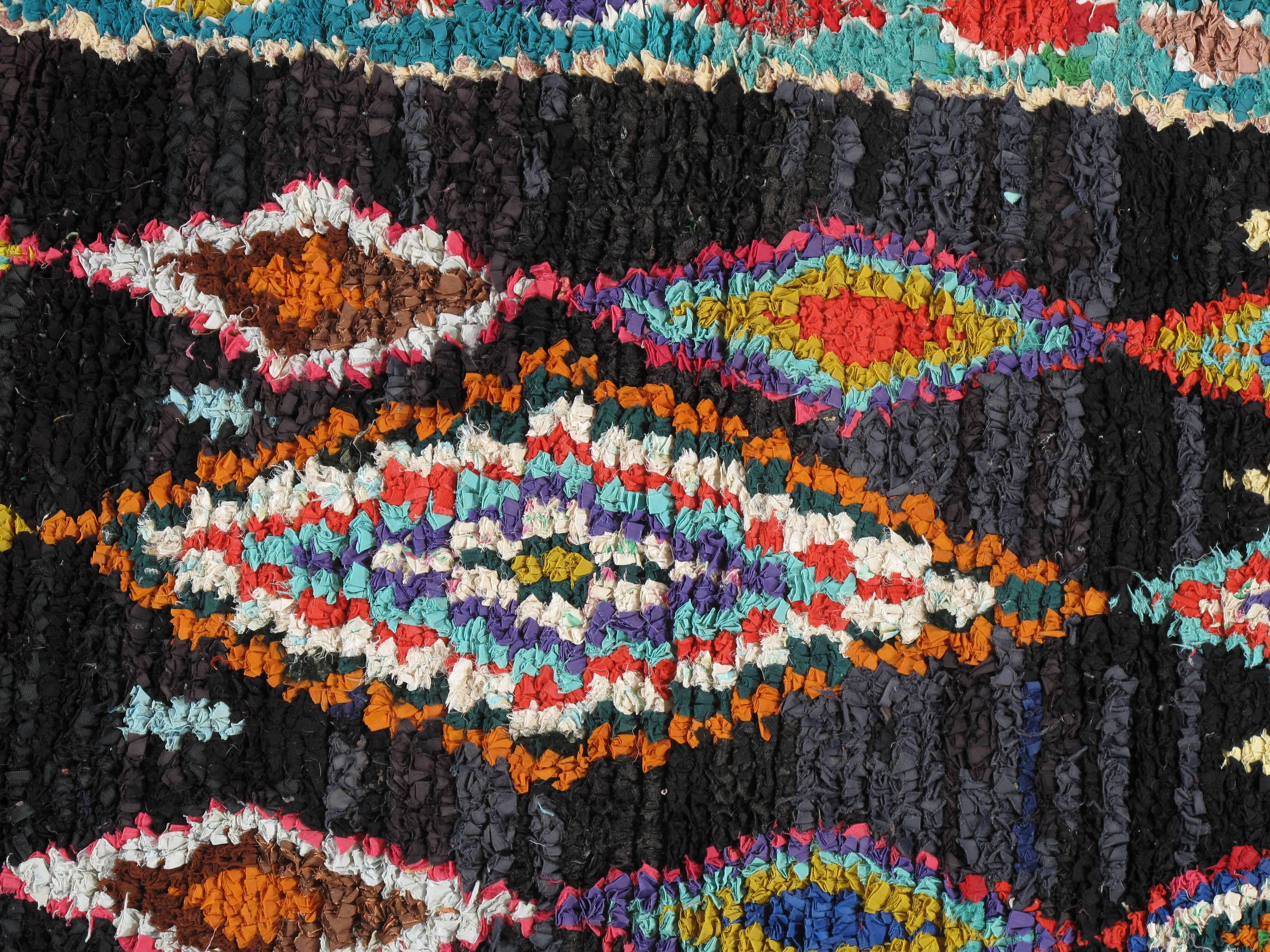 Moroccan rug from Azilal in the Atlas Mountains. Hand-knotted by village women using a generations-old weaving technique. Made of rag material, cotton and wool. Minor low areas.