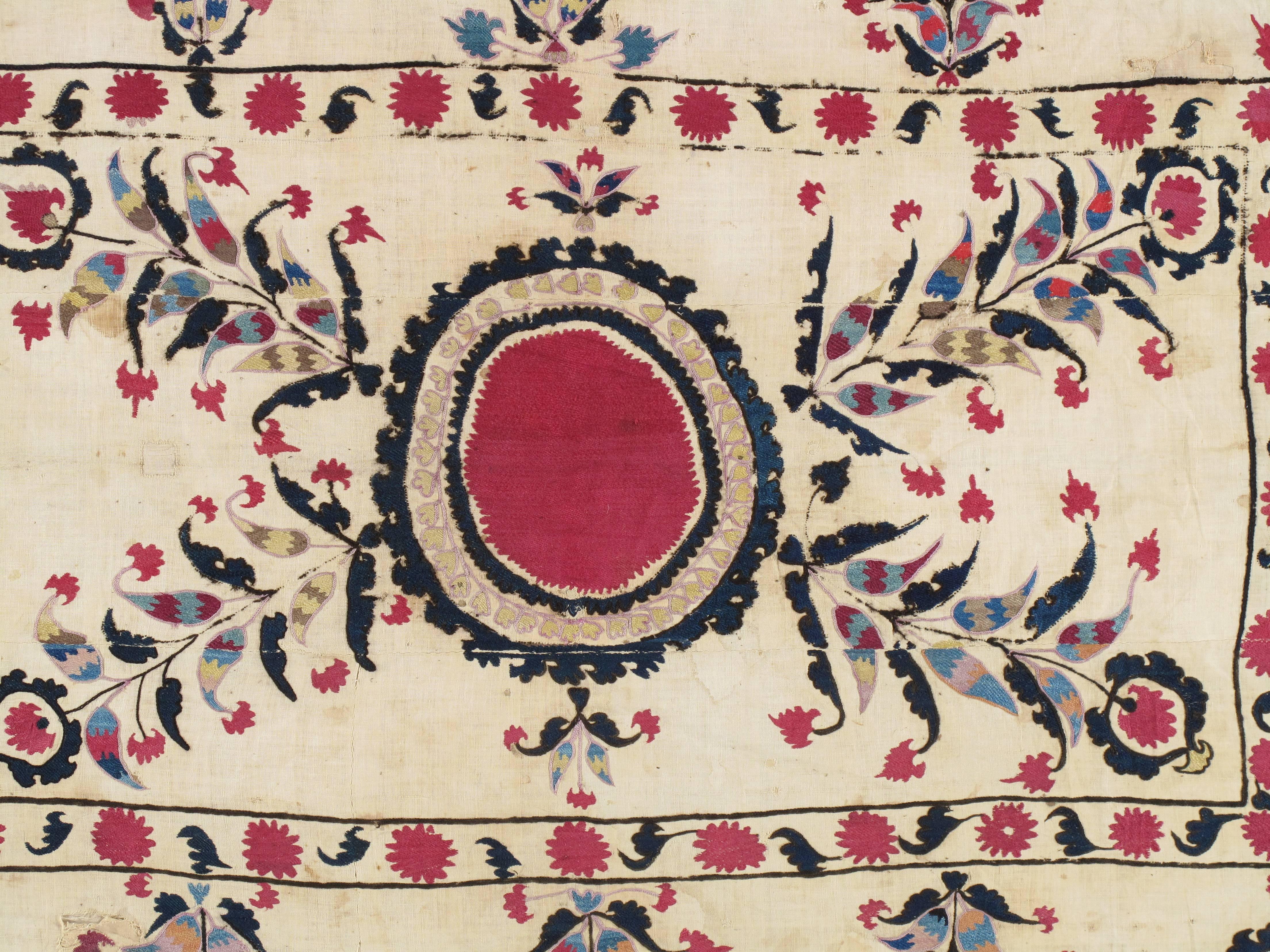 Museum quality silk-on-cotton-ground antique Suzani with hand-embroidery. Fine floral design. This Suzani embroidery has the most noticeable, soporific color pallet. Very fine, 19th century Suzani textile. Beautiful early piece. With vibrant silk