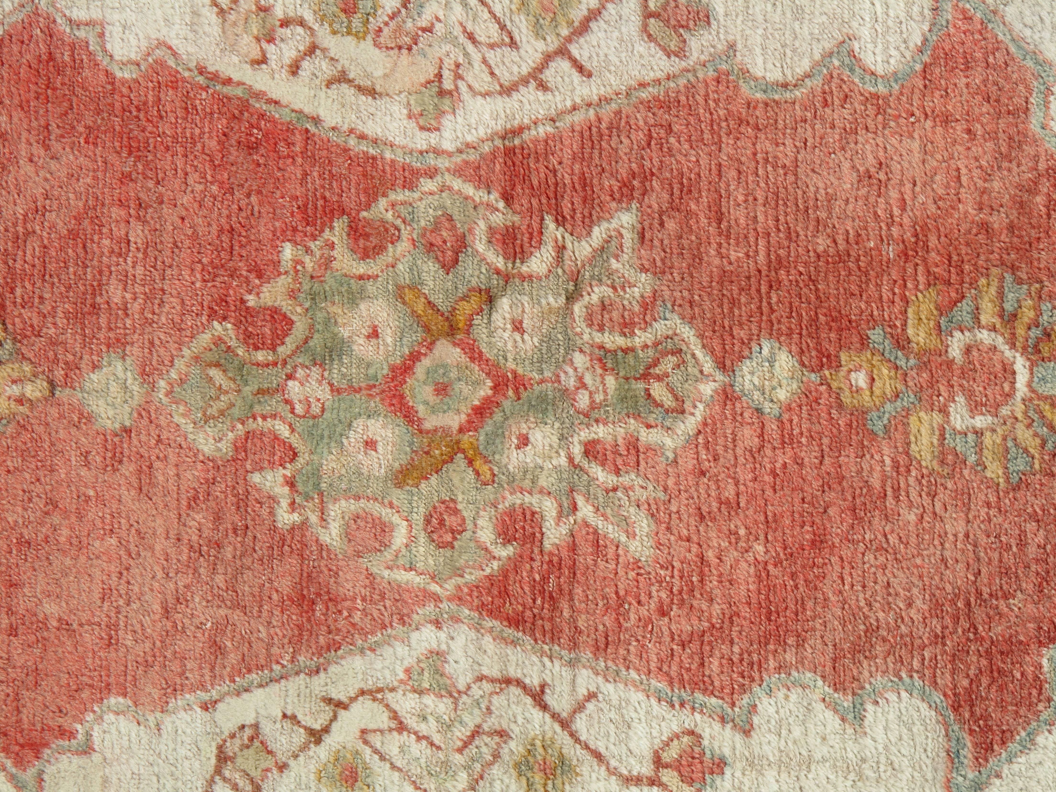 Turkish carpet from Oushak with a combination of soft colors having an all-over design. Finely woven, having the most superb wool found in the mountains of Anatolia. This is a fine example of a antique Oushak. Please contact us for more information.