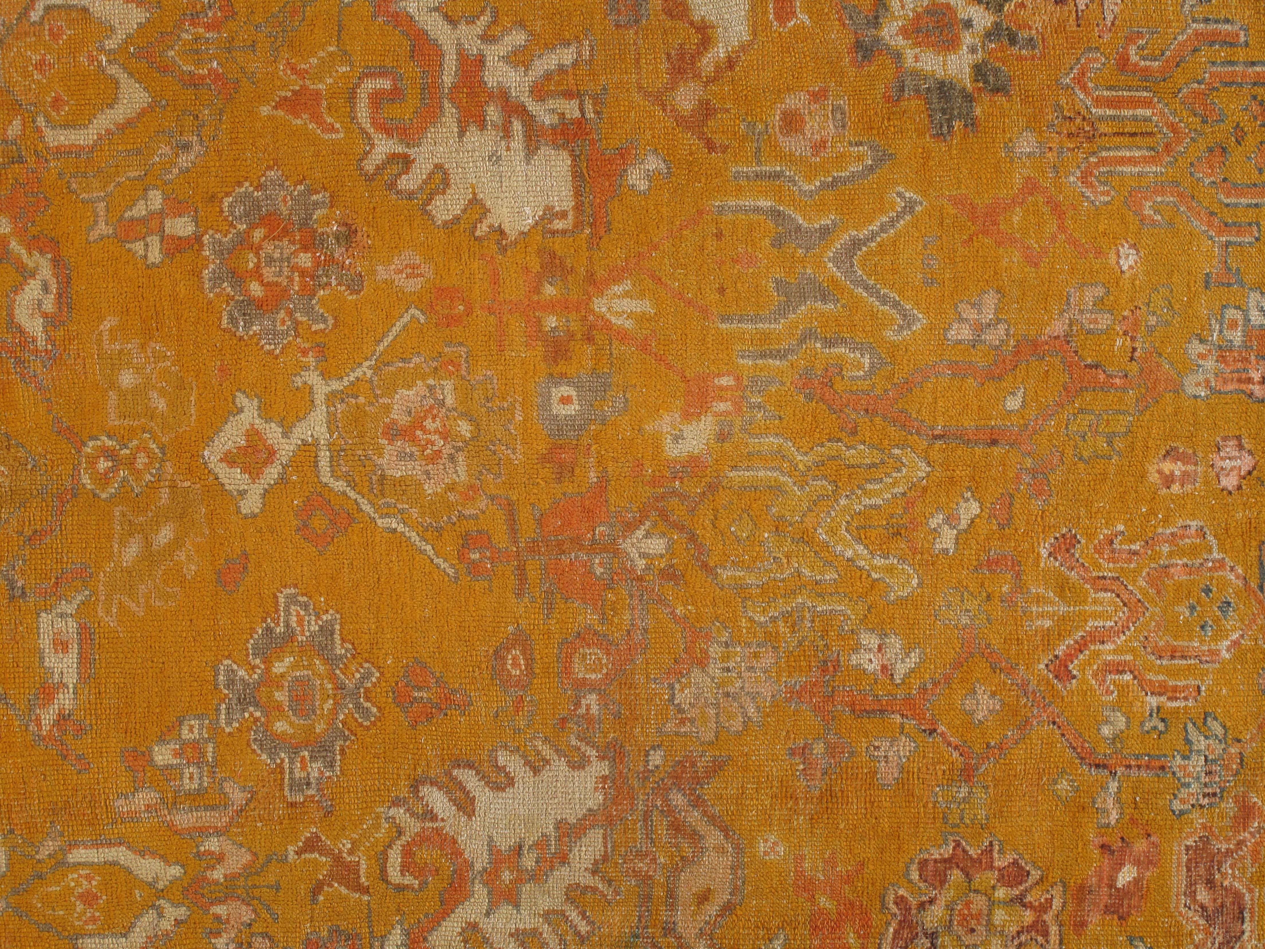 Turkish carpet from Oushak with a combination of soft colors having an all-over design. Finely woven, having the most superb wool found in the mountains of Anatolia. This is a fine example of an antique Oushak. Please contact us for more