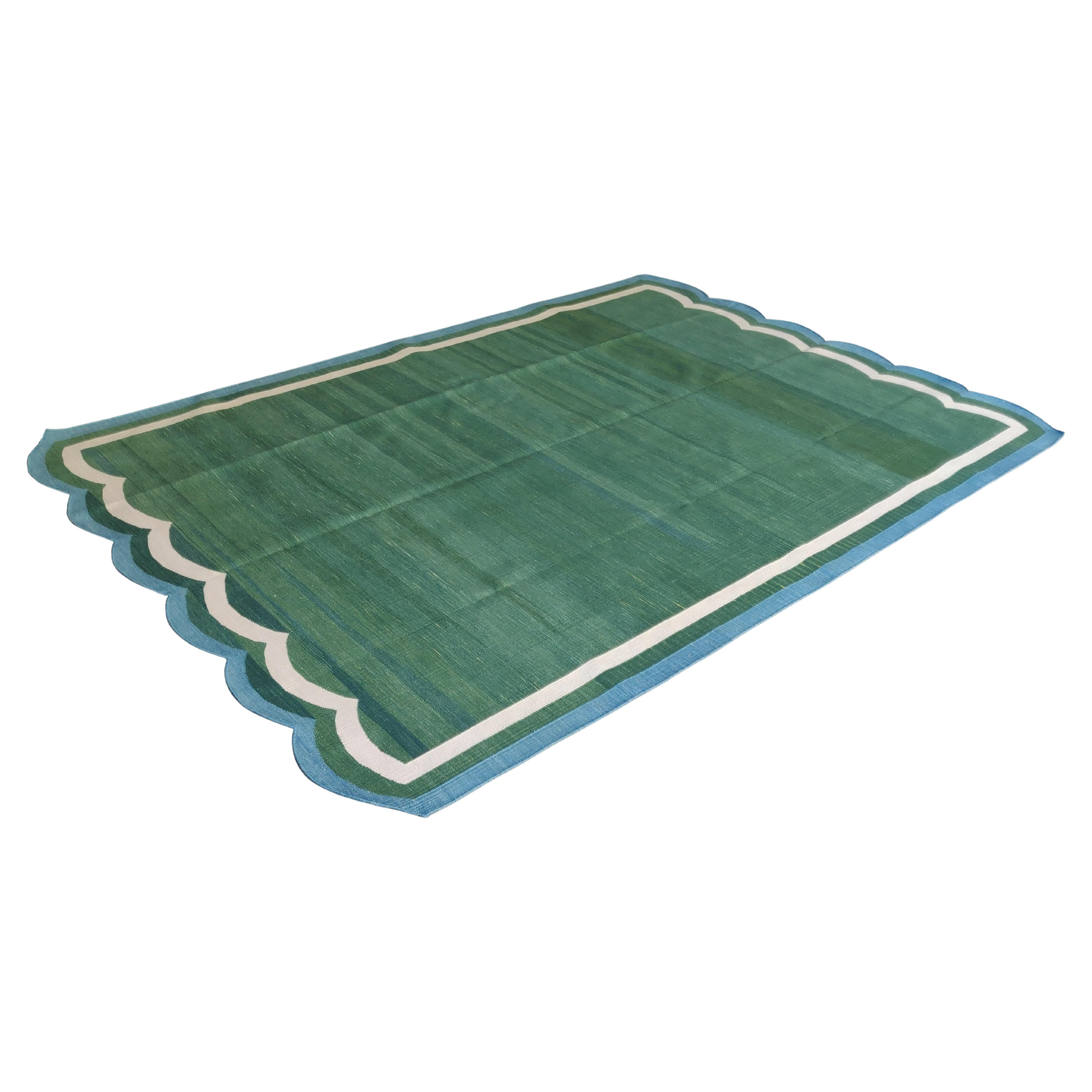 Cotton Vegetable Dyed Forest Green And Blue Two Sided Scalloped 
Indian Rug-6'x9' (180x270cm)
These special flat-weave dhurries are hand-woven with 15 ply 100% cotton yarn. Due to the special manufacturing techniques used to create our rugs, the
