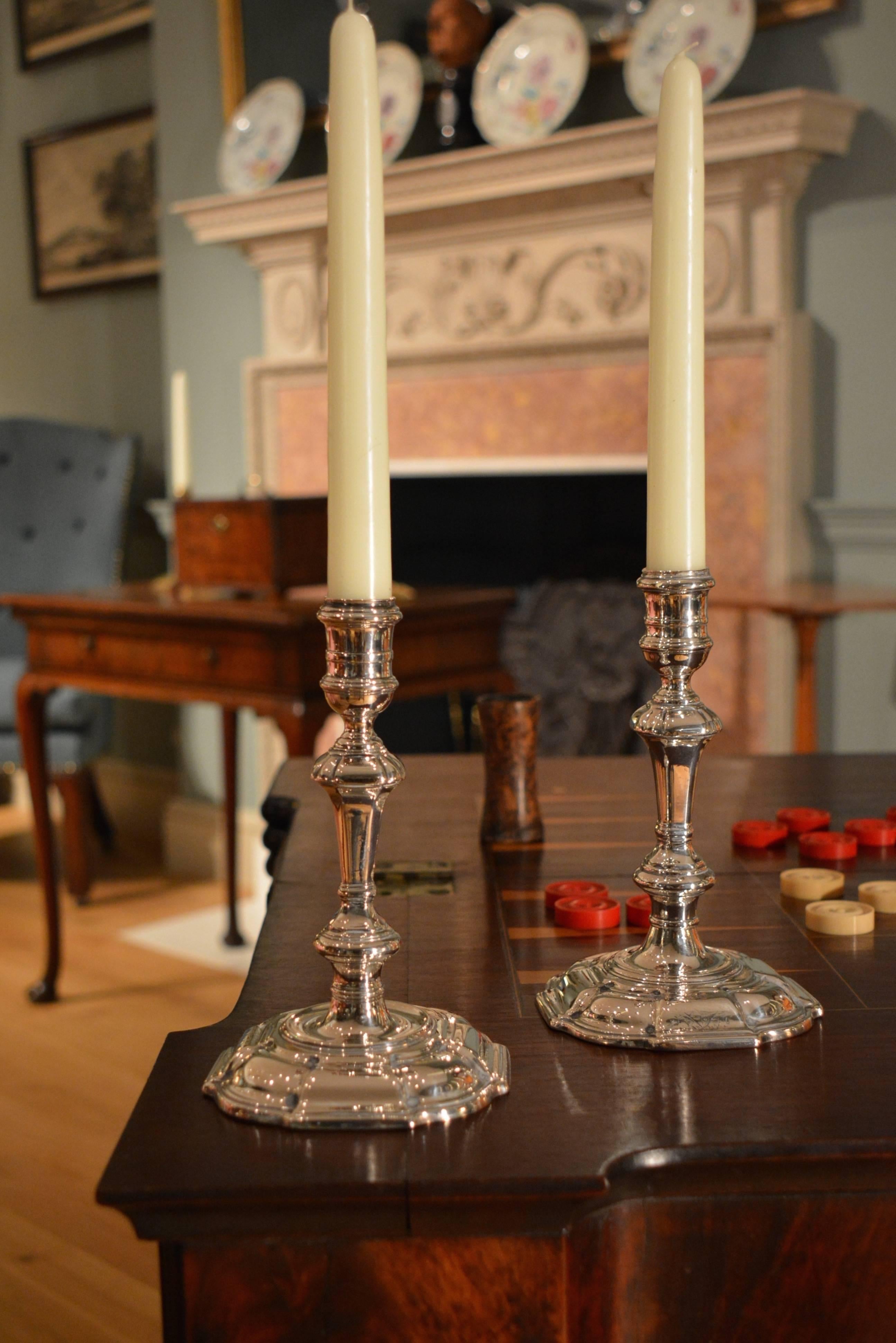 A matched pair of George II silver candlesticks