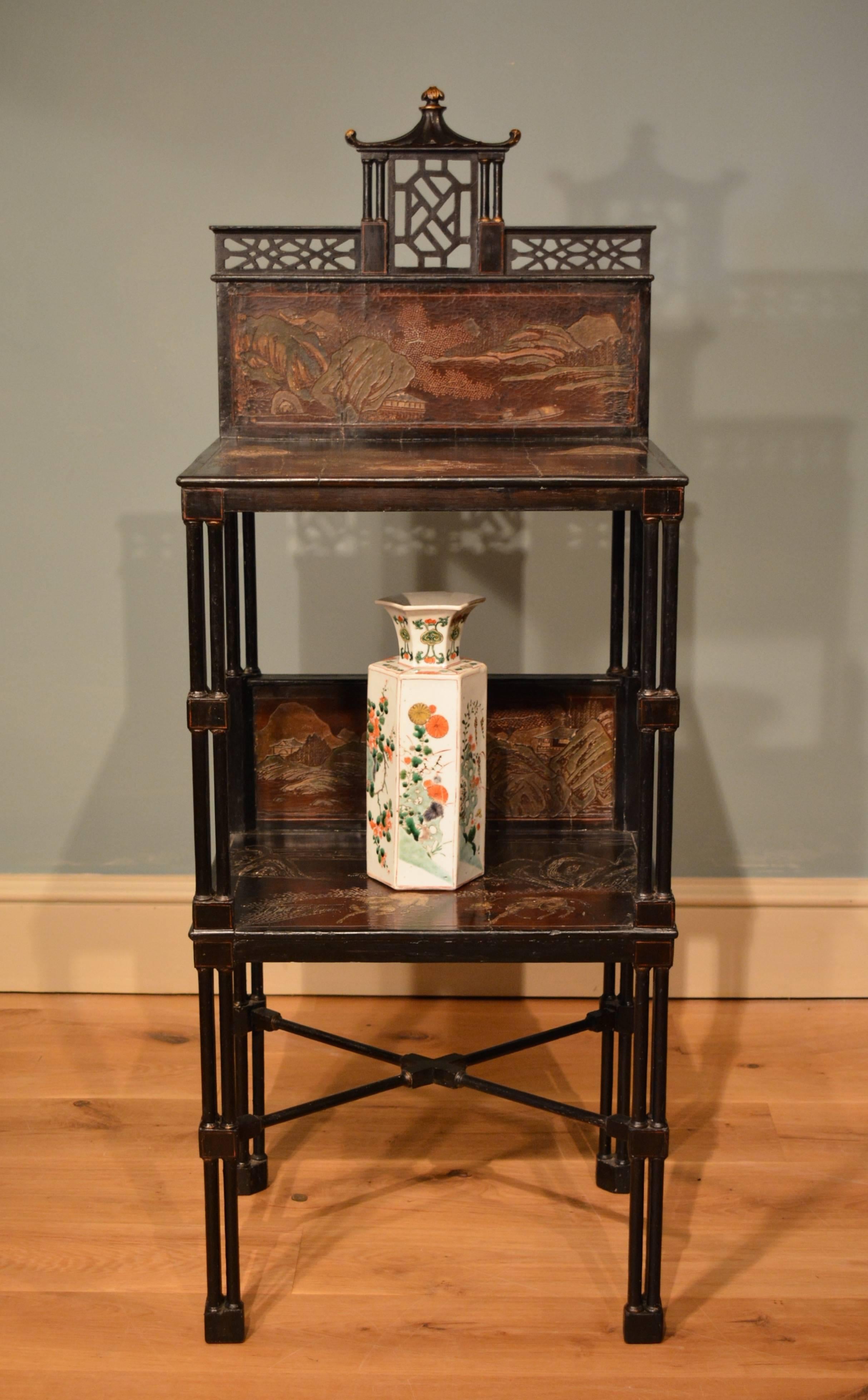 A George III Chippendale period japanned etagere which incorporates Chinese coromandel panels of circa 1700.