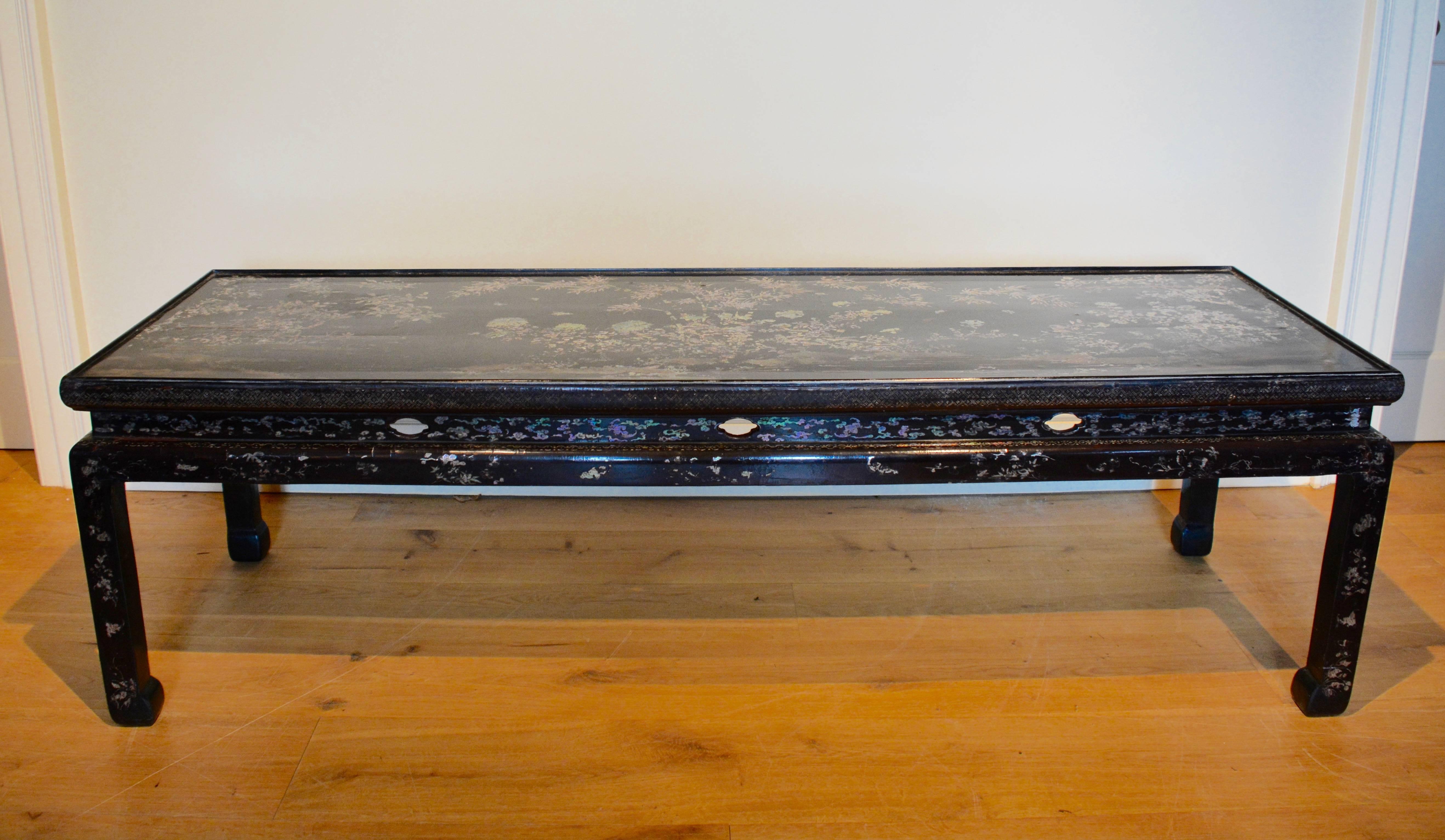 A mid-18th century Chinese lacquer centre table, with the legs now reduced in height to form a European coffee table.