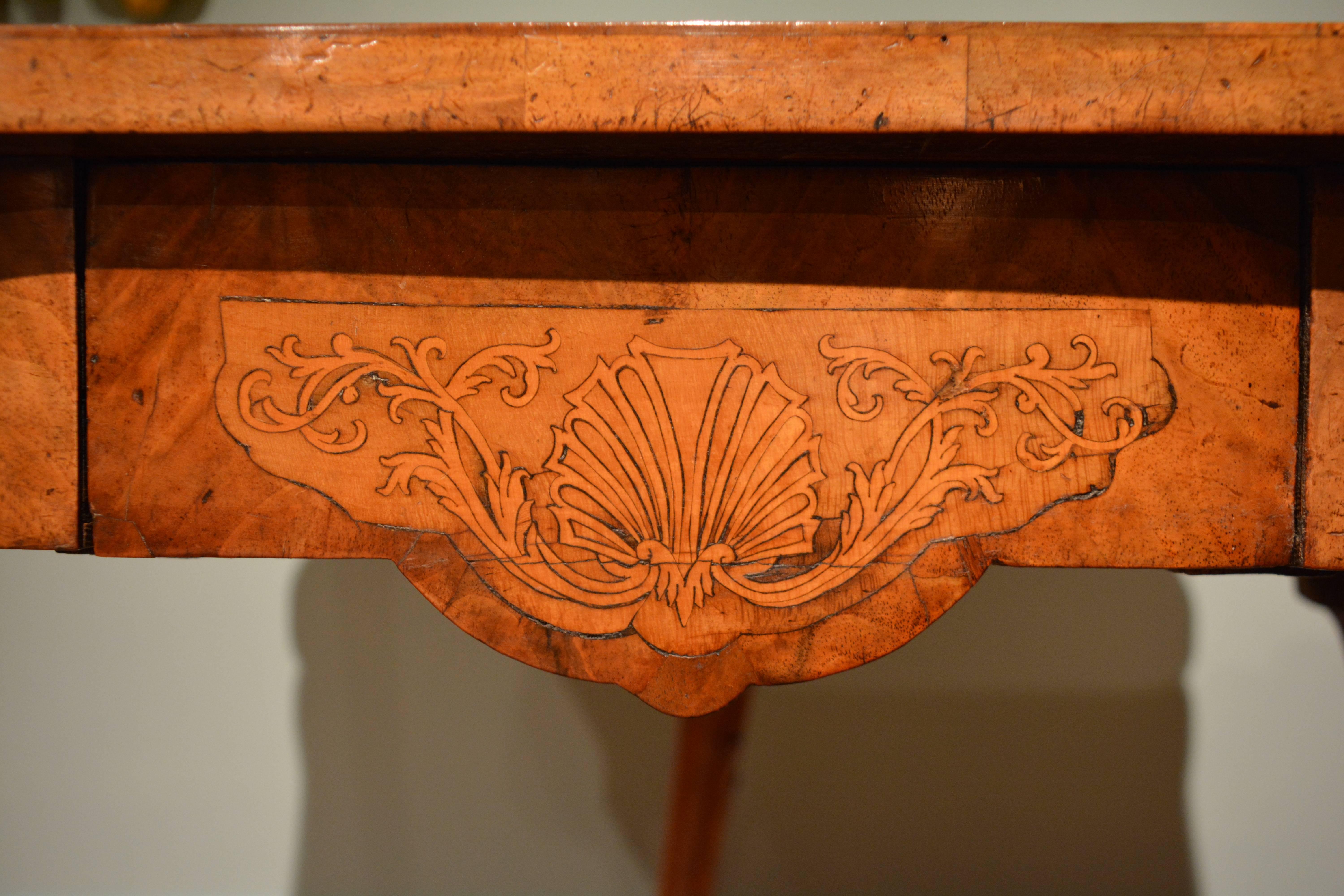 A rare 18th century Irish veneered walnut card table of small size, the cabriole legs, drawer front, top and interior finely inlaid with marquetry panels, Irish, circa 1750.