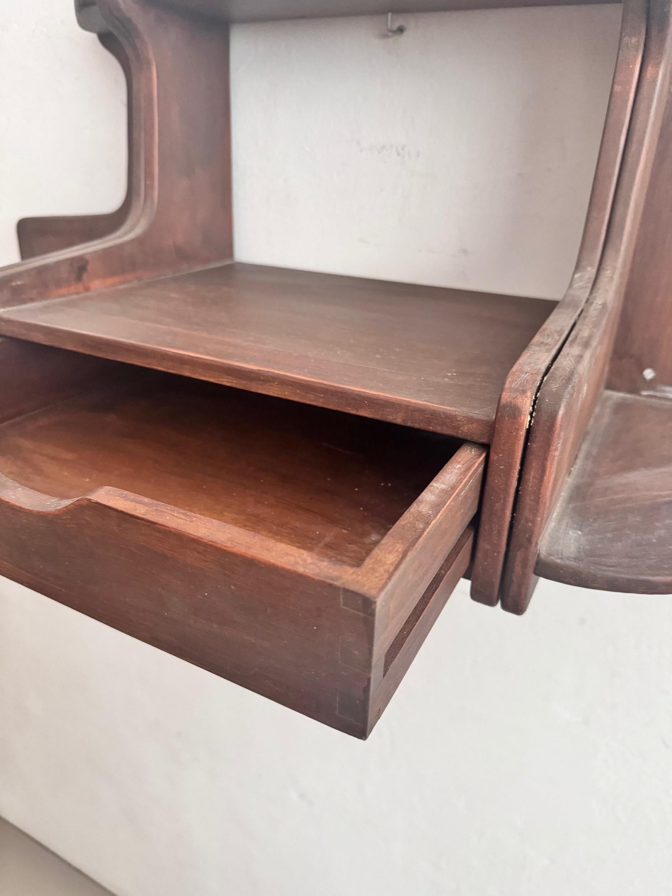 Mid 20th century Spanish wall shelve unit.    Made by unknown manufacturer from France, circa 1960.    In original condition, with minor wear consistent with age and use, preserving a beautiful patina.    Material:  Wood.    